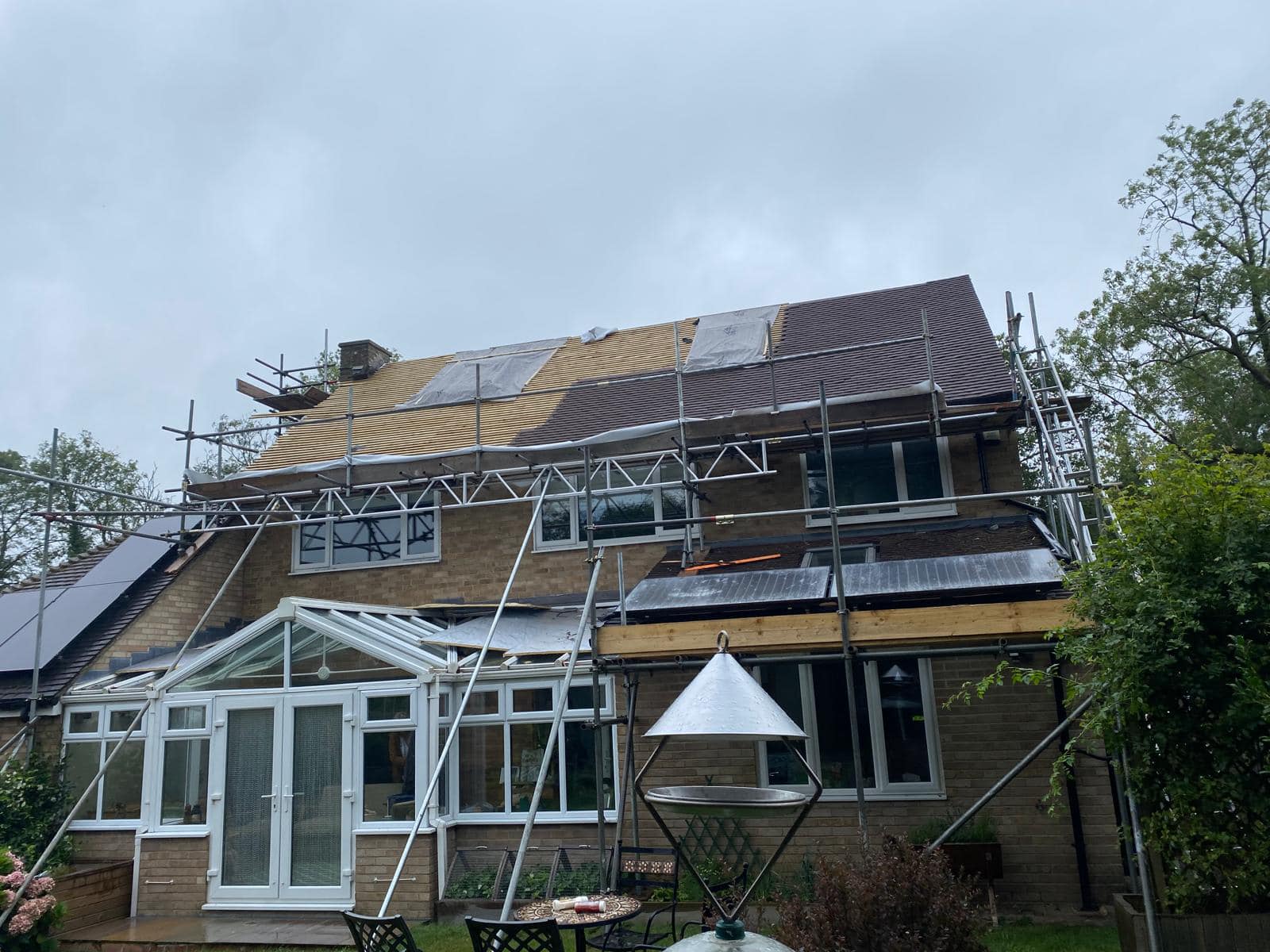 Professional roofers working on a property in London - KS Roof Master