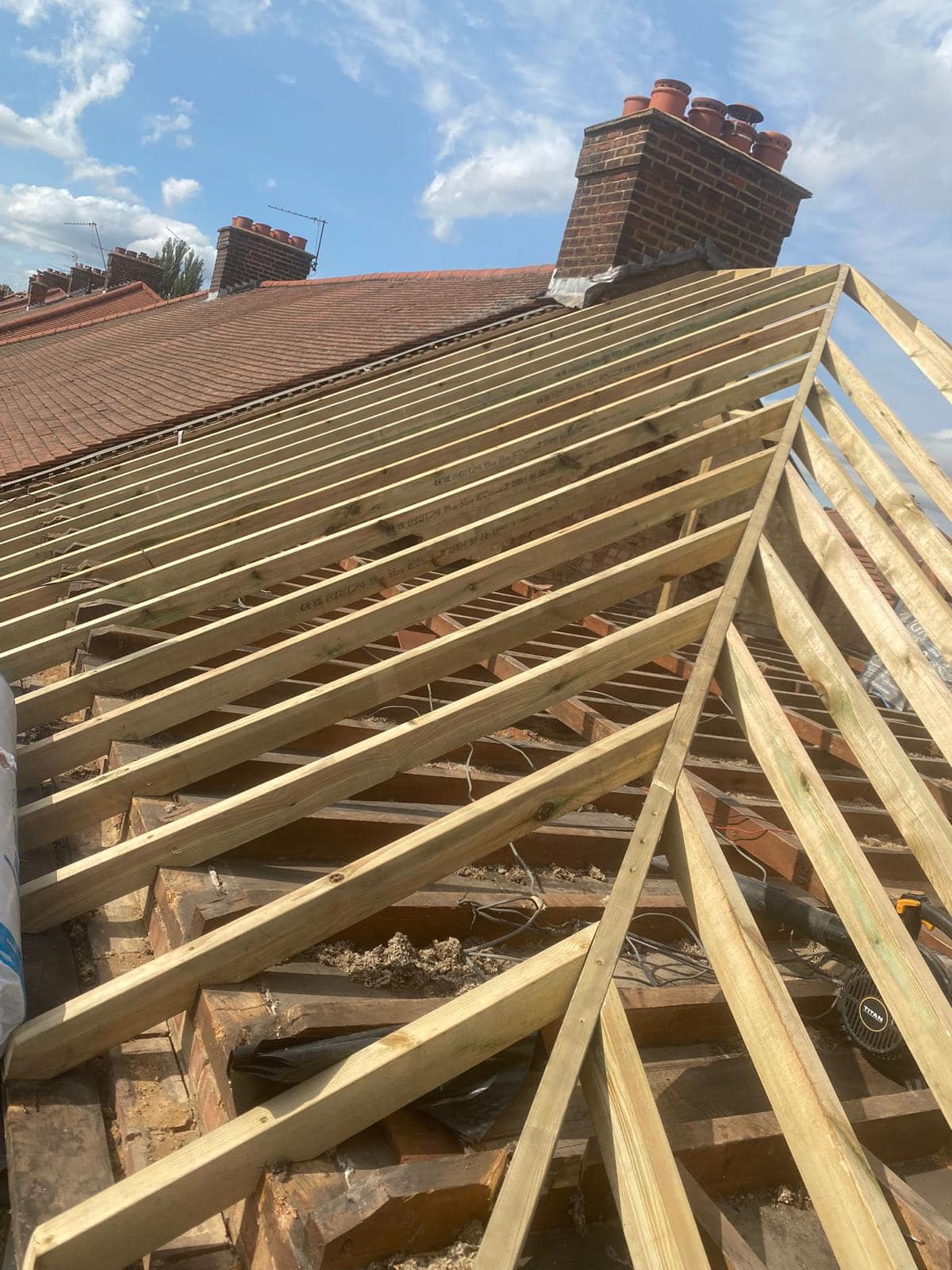 Professional roofers working on a property in London - KS Roof Master