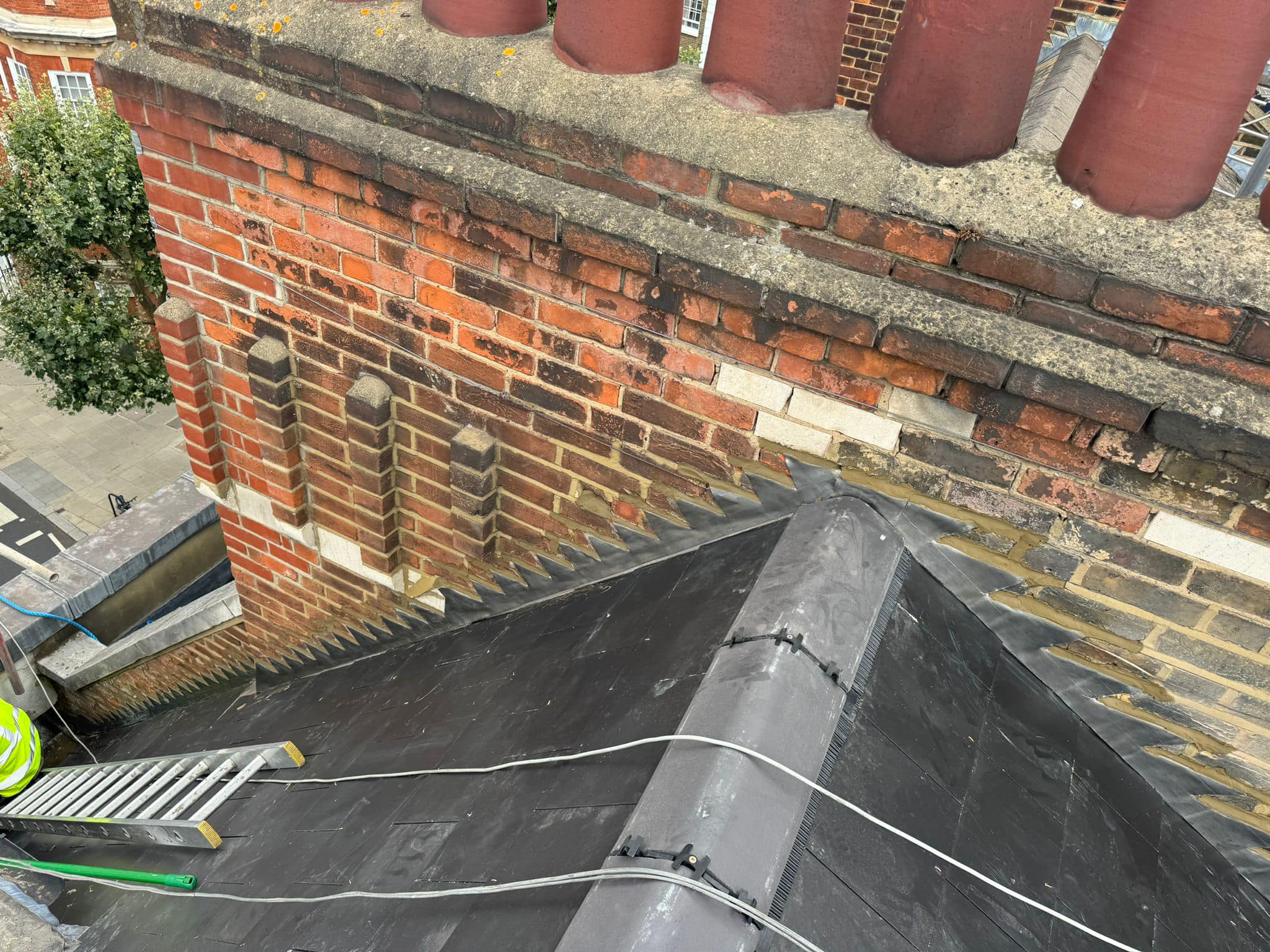 Professional roofers working on a property in London - KS Roof Master