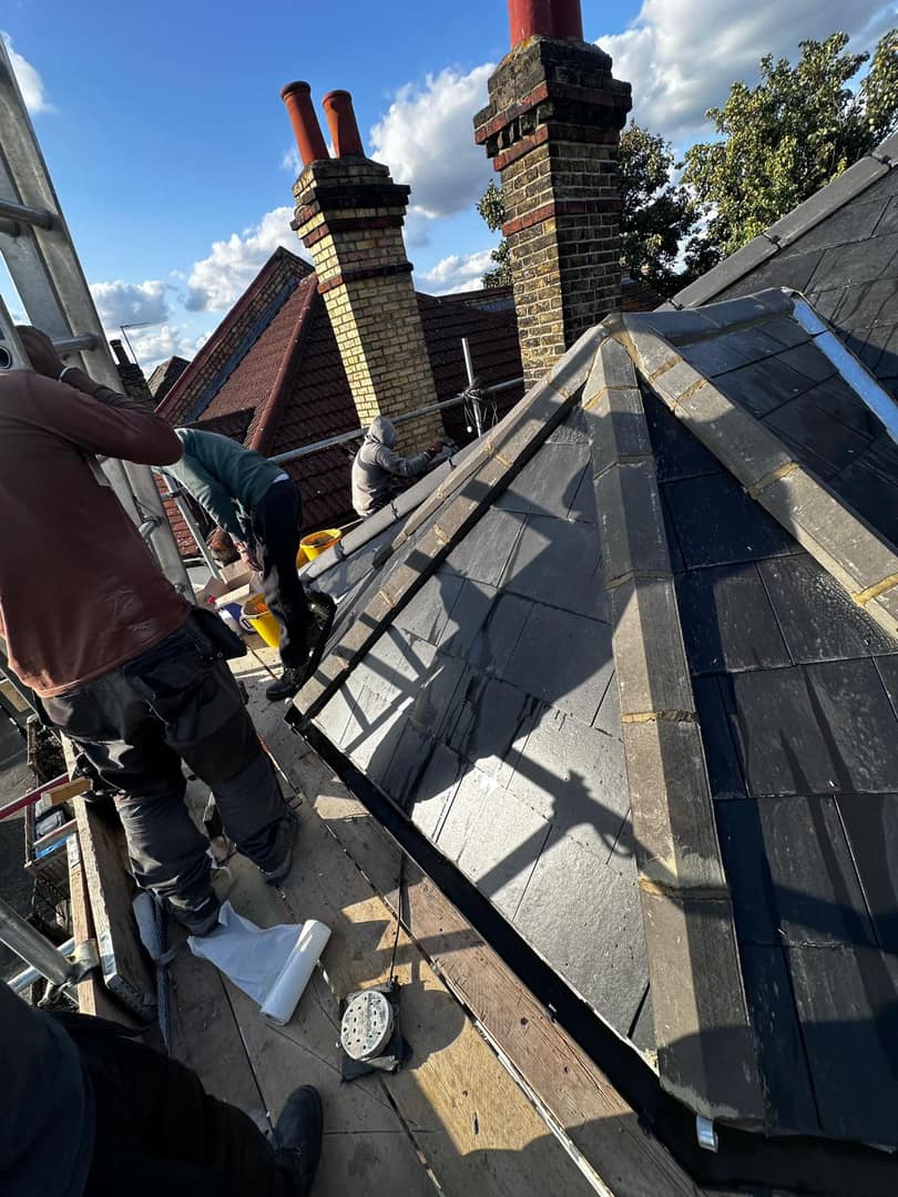 Professional roofers working on a property in London - KS Roof Master