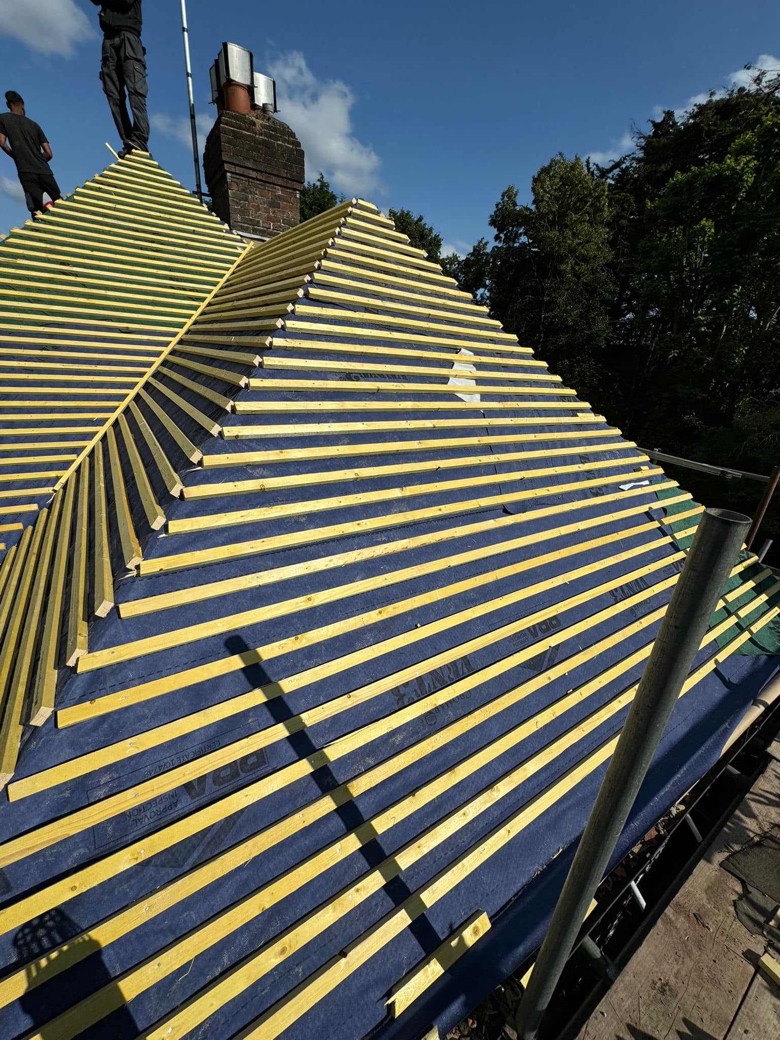 Professional roofers working on a property in London - KS Roof Master
