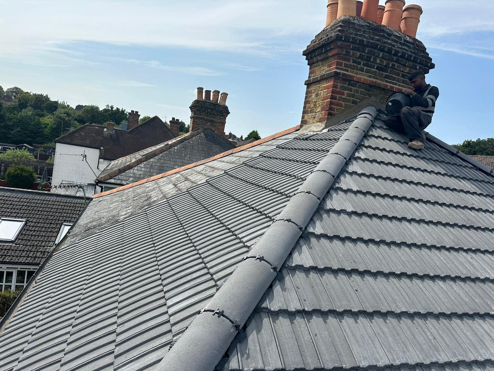 Professional roofers working on a property in London - KS Roof Master