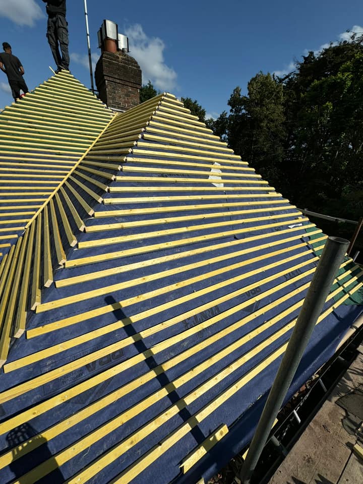 Professional roofers working on a property in London - KS Roof Master