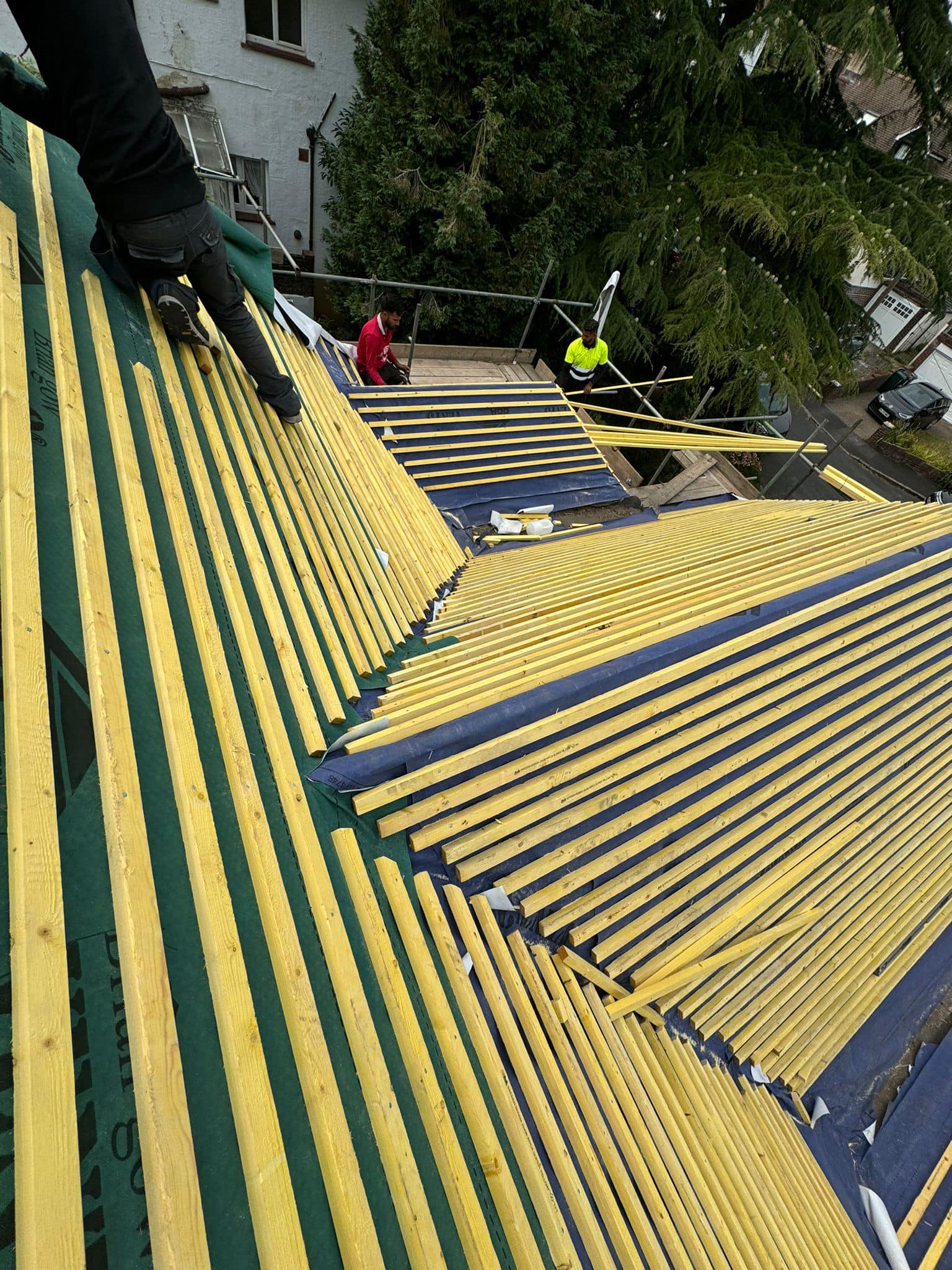 Professional roofers working on a property in London - KS Roof Master