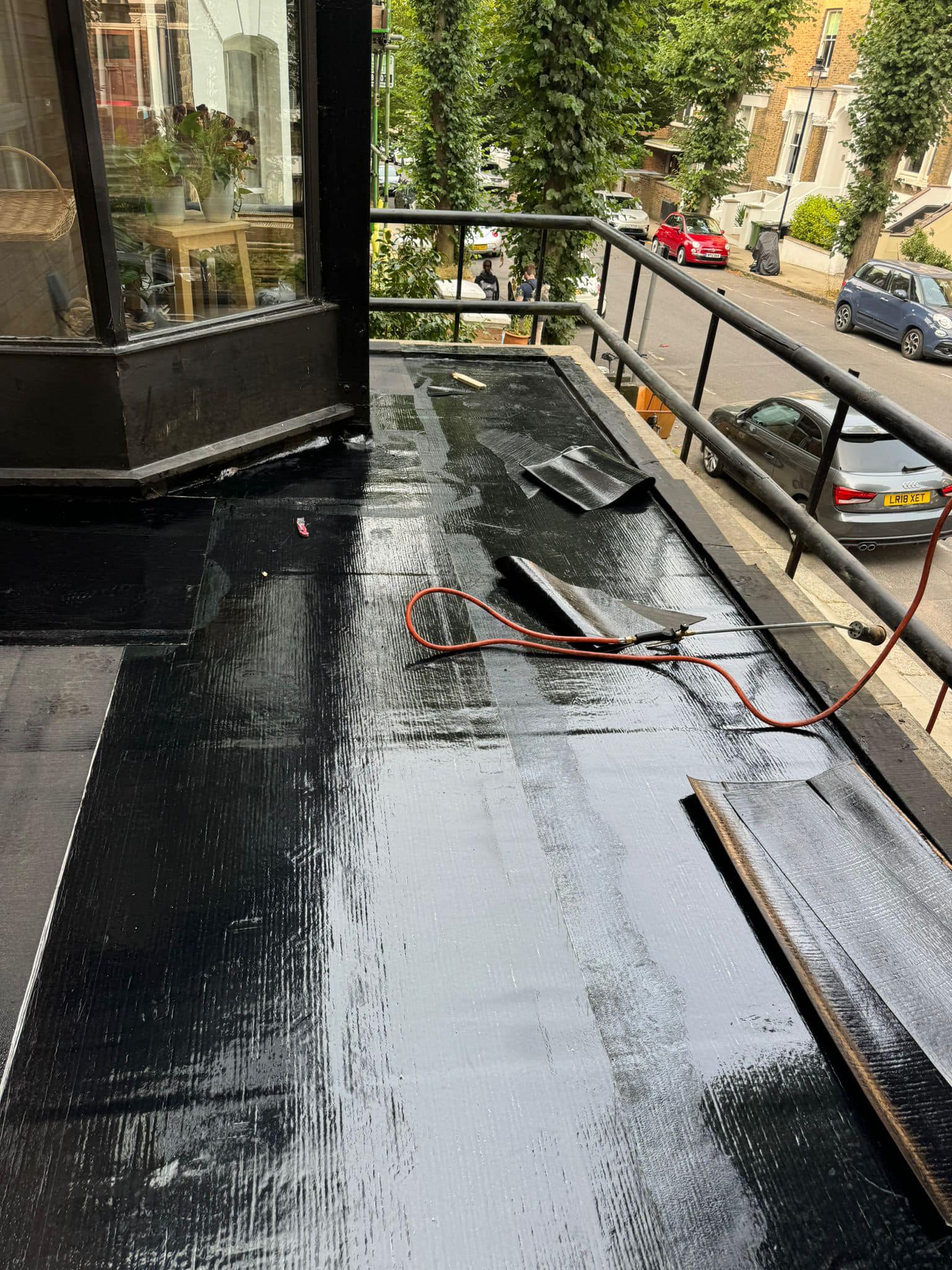 Professional roofers working on a property in London - KS Roof Master