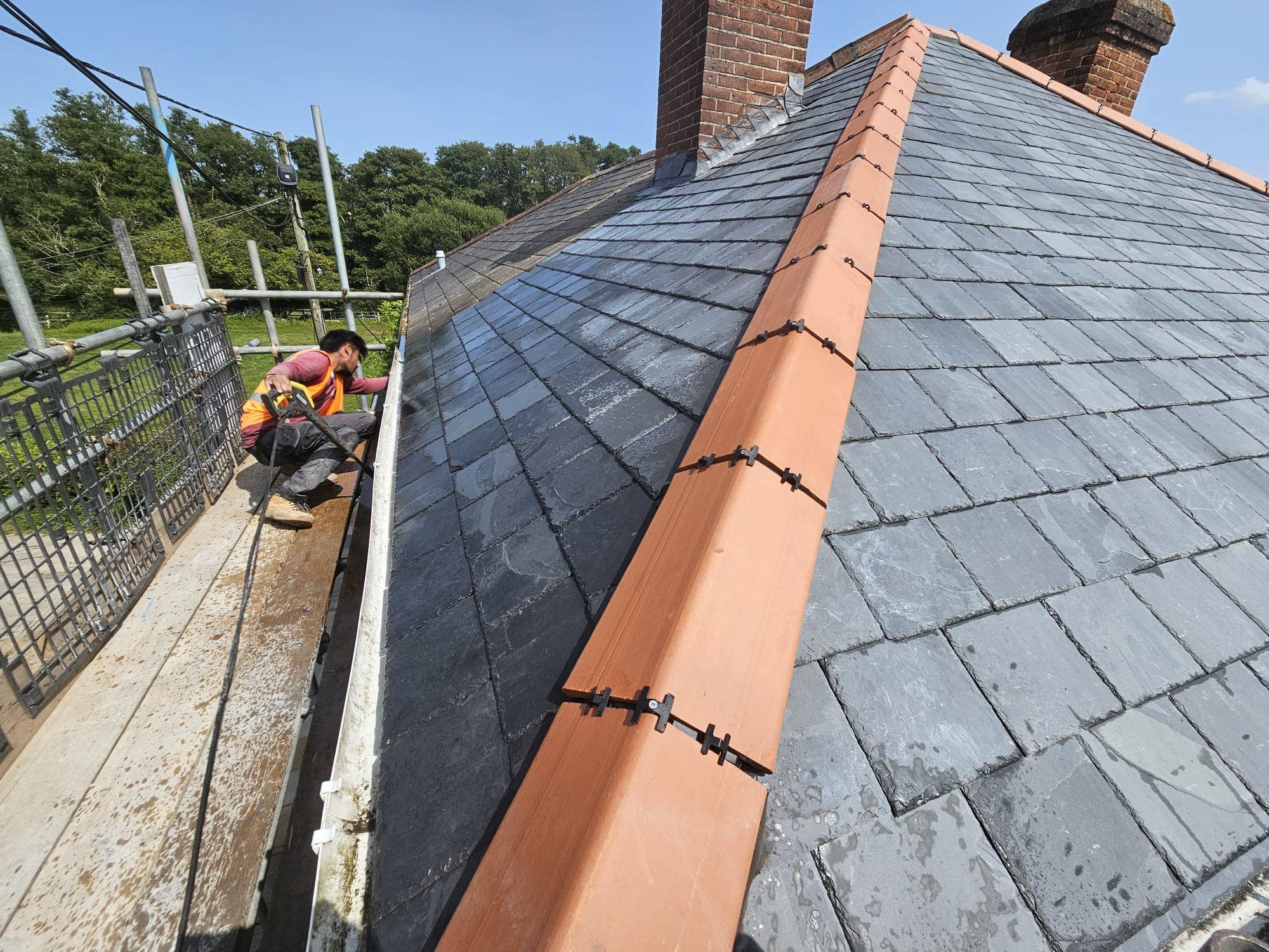 Professional roofers working on a property in London - KS Roof Master