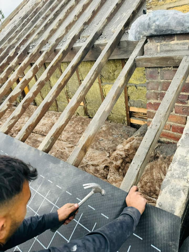 Professional roofers working on a property in London - KS Roof Master