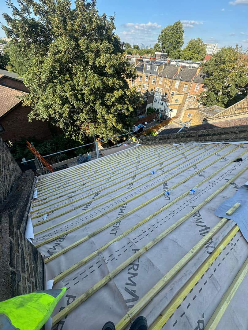 Professional roofers working on a property in London - KS Roof Master