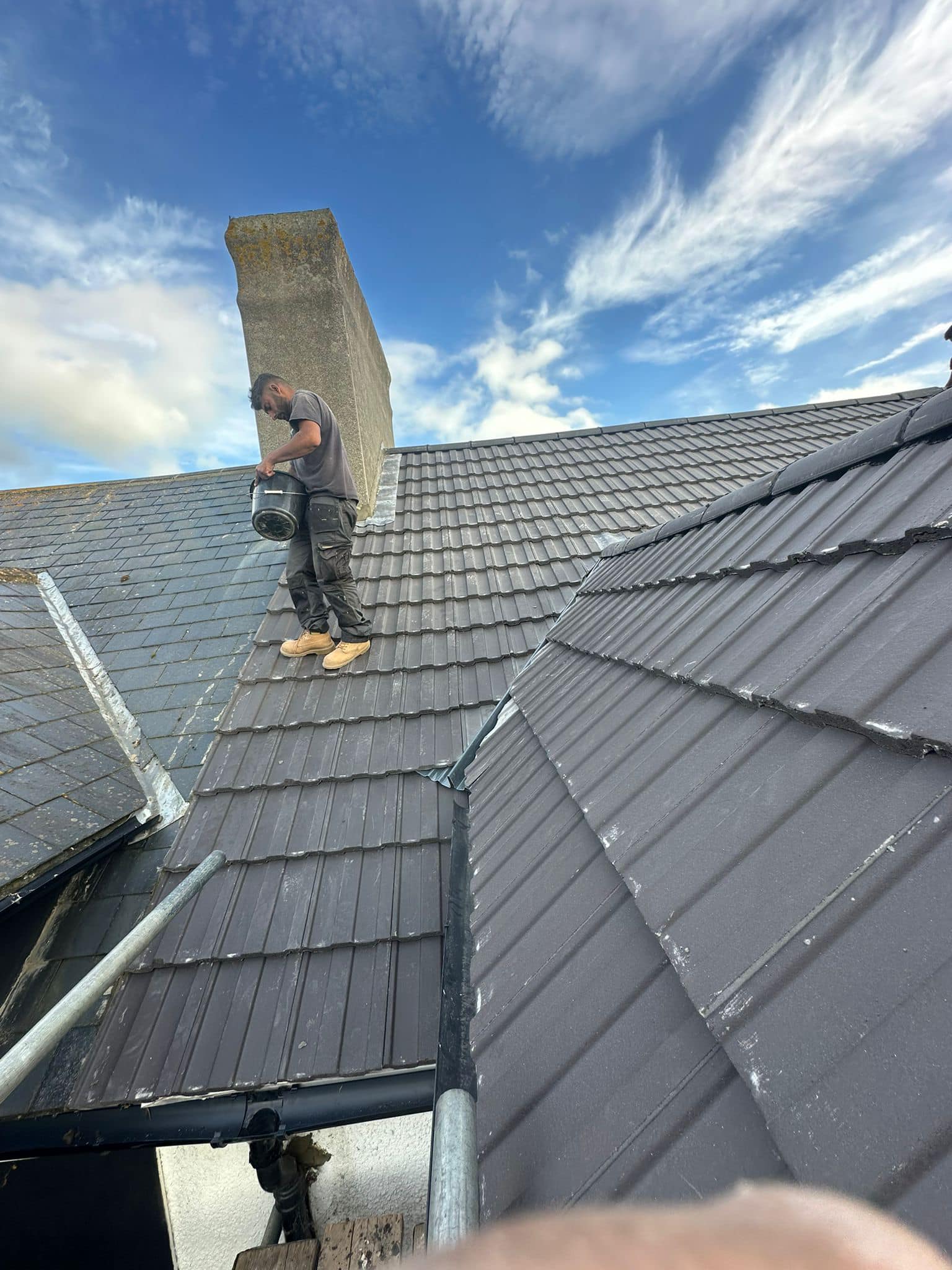 Professional roofers working on a property in London - KS Roof Master