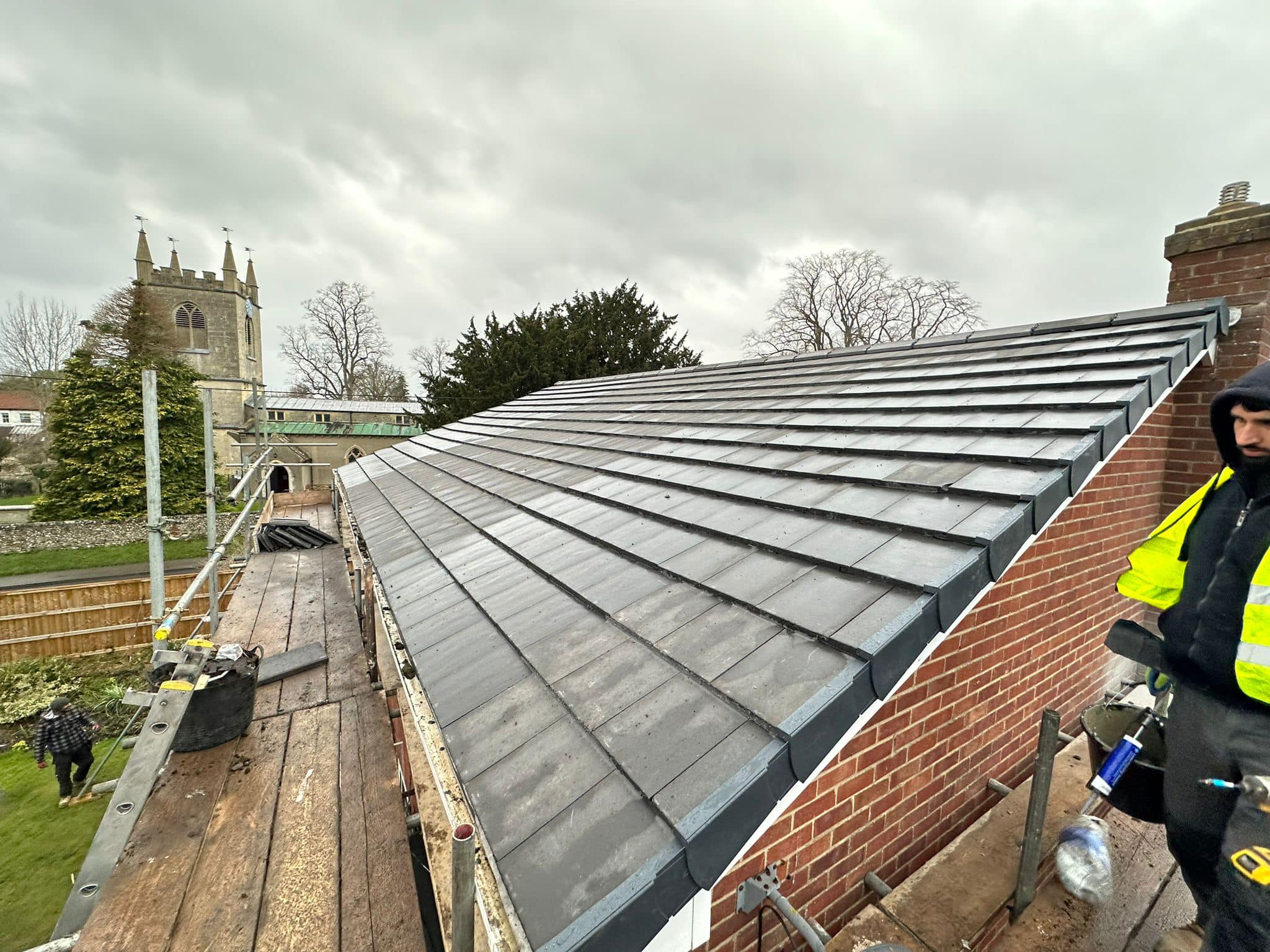 Professional roofers working on a property in London - KS Roof Master