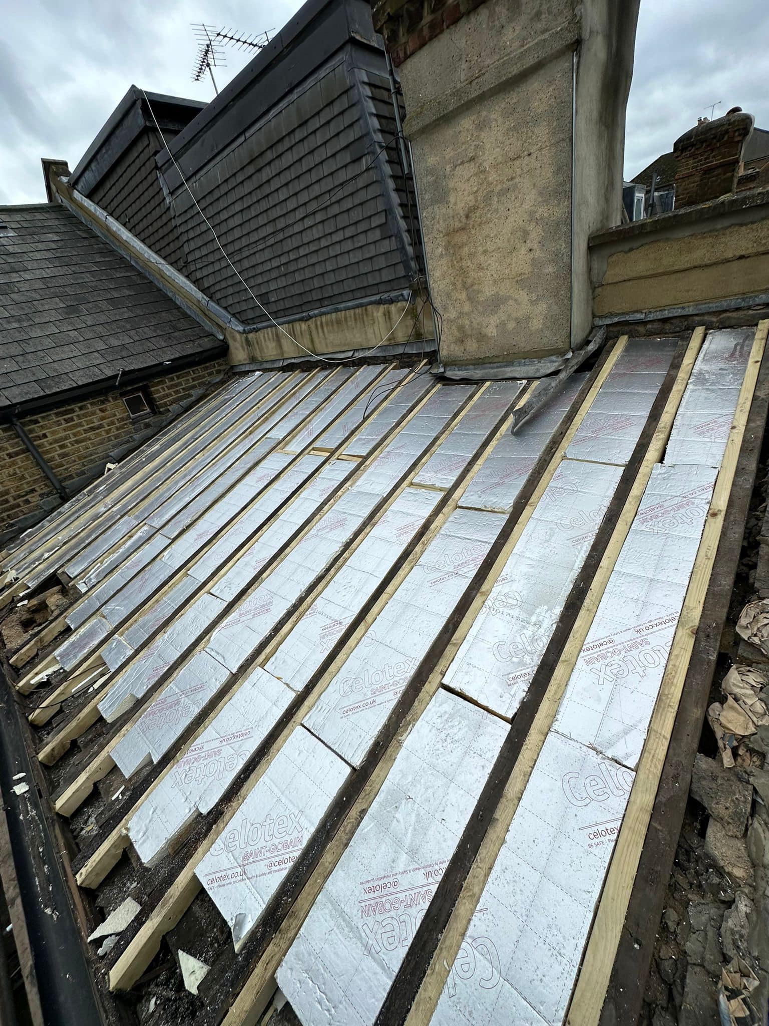 Professional roofers working on a property in London - KS Roof Master