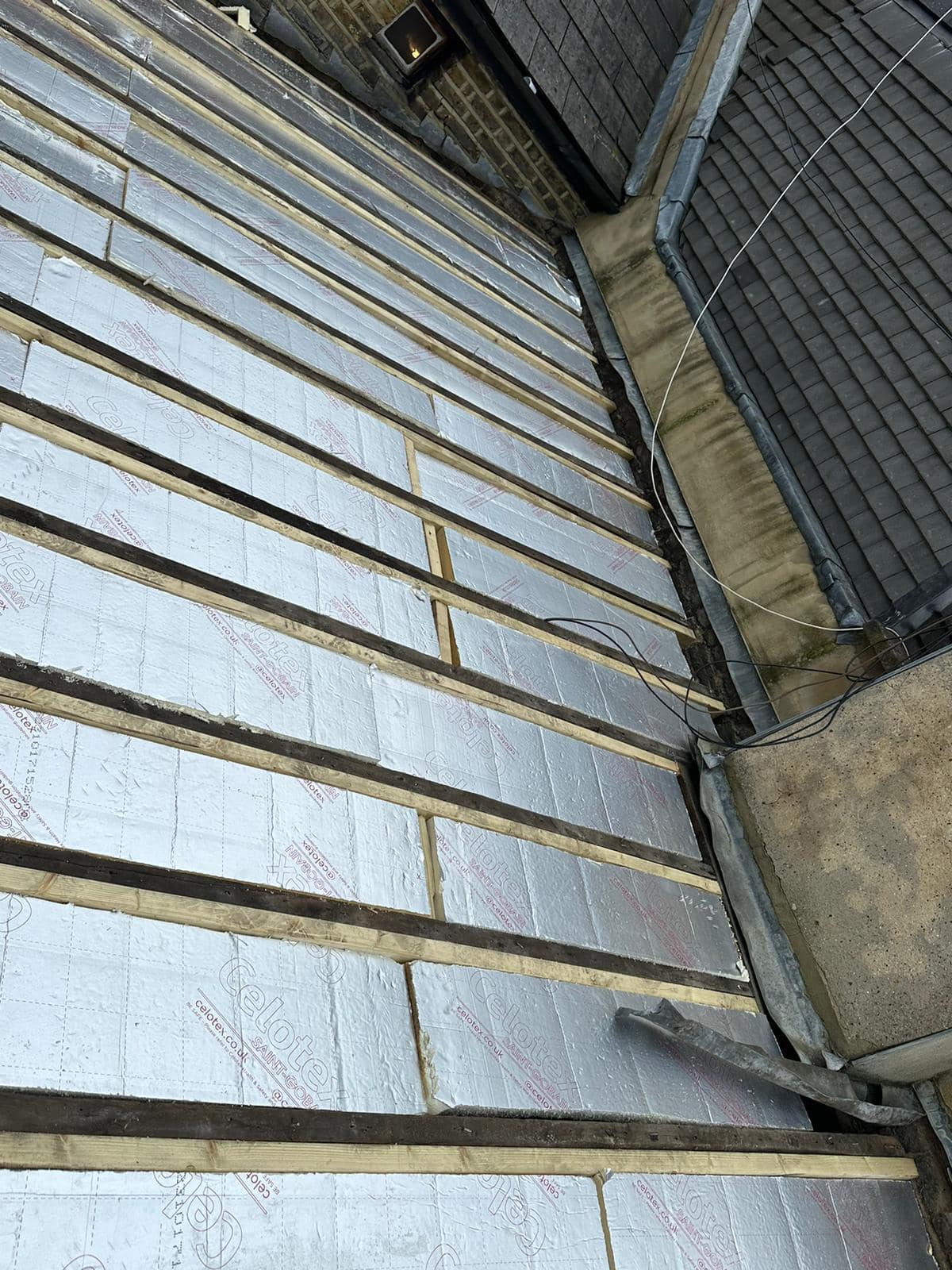 Professional roofers working on a property in London - KS Roof Master