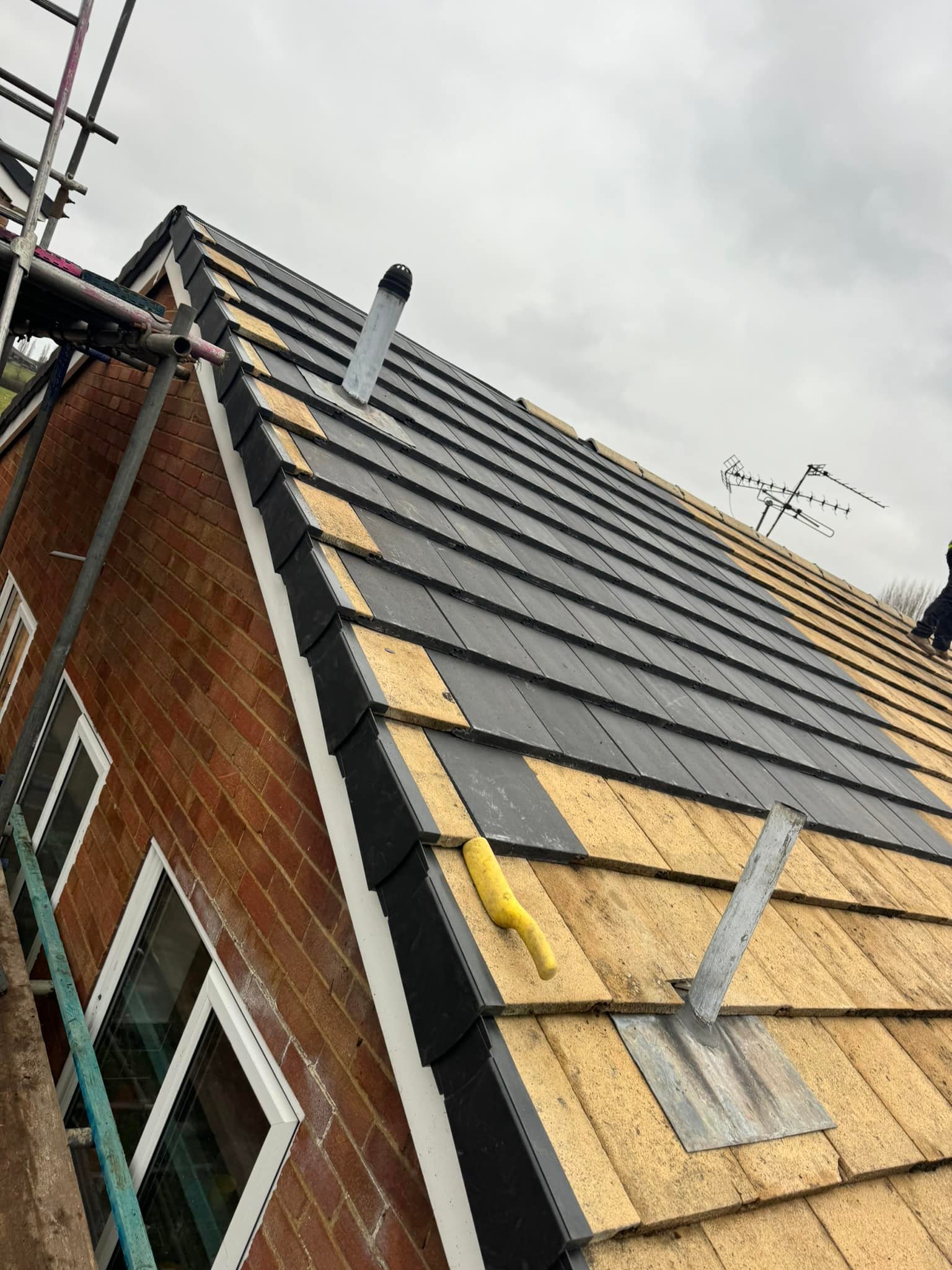 Professional roofers working on a property in London - KS Roof Master