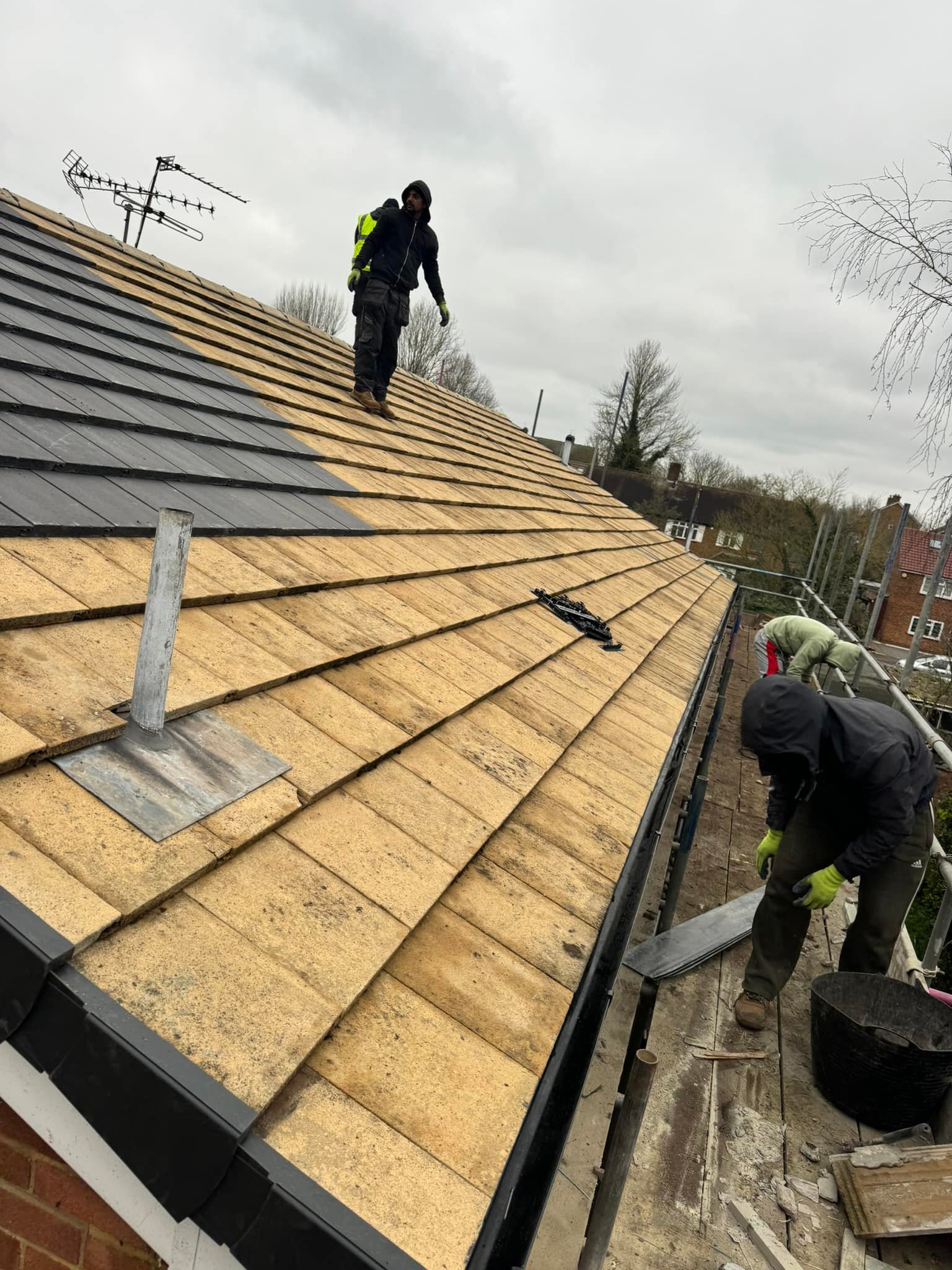 Professional roofers working on a property in London - KS Roof Master