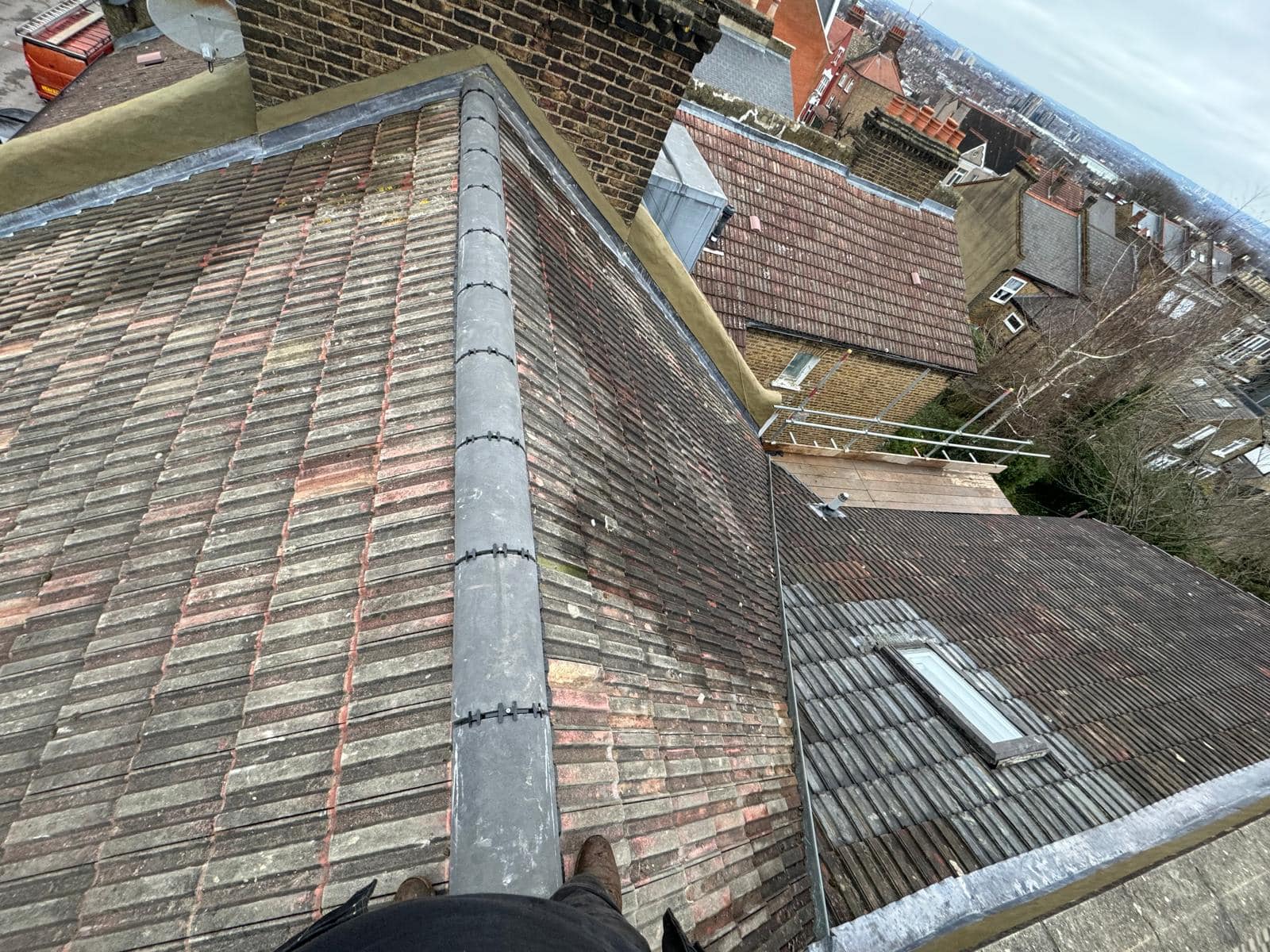 Professional roofers working on a property in London - KS Roof Master