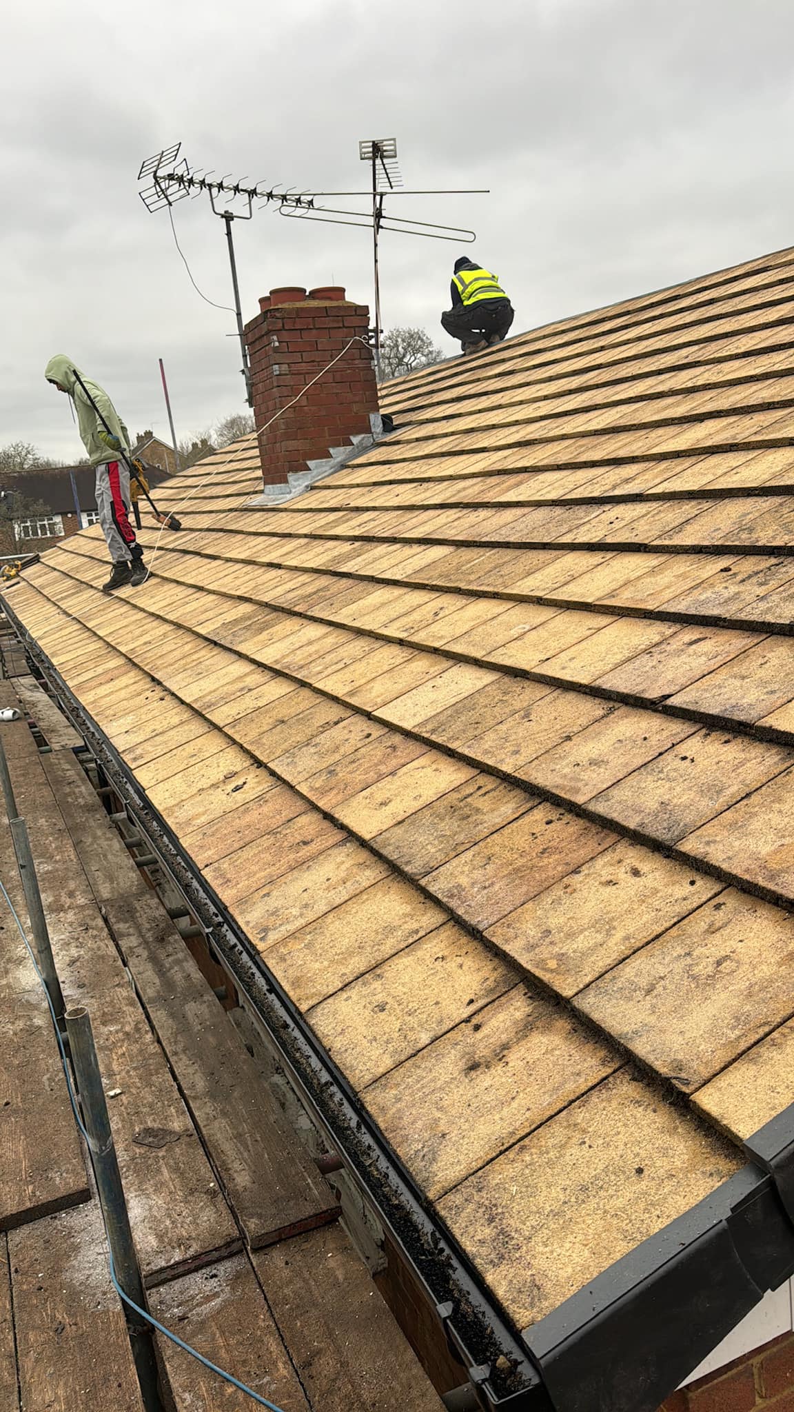 Professional roofers working on a property in London - KS Roof Master