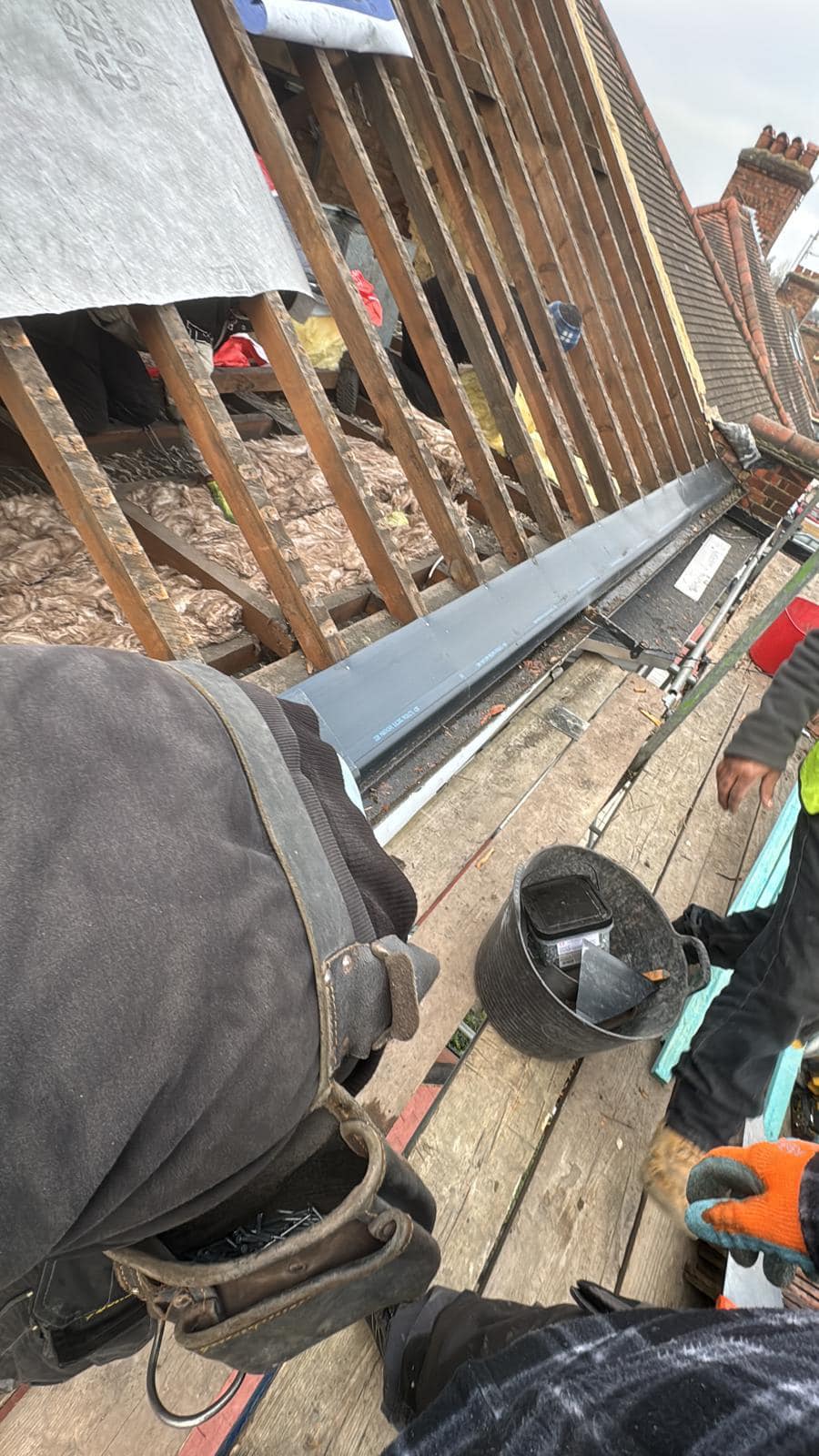 Professional roofers working on a property in London - KS Roof Master