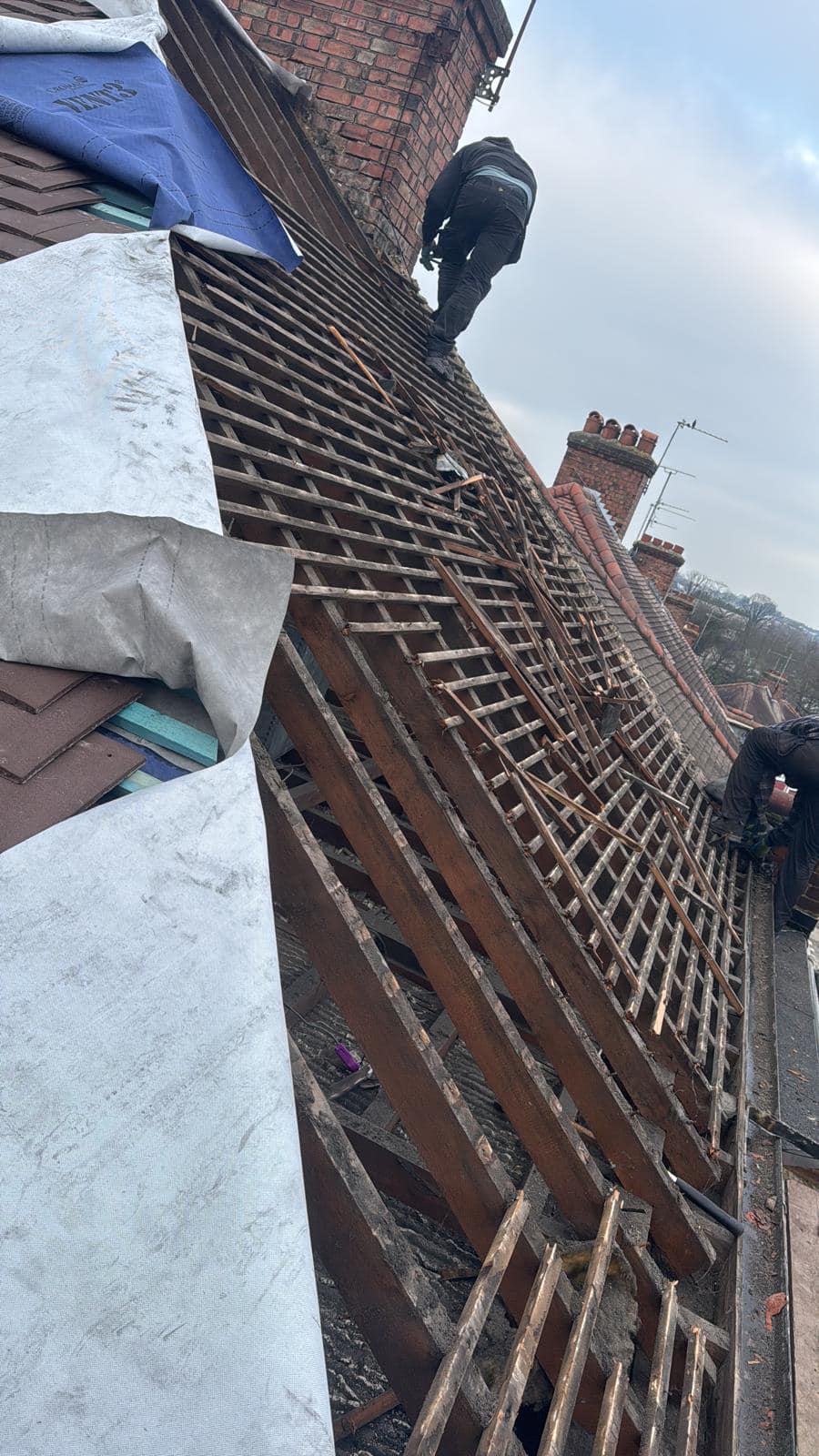 Professional roofers working on a property in London - KS Roof Master