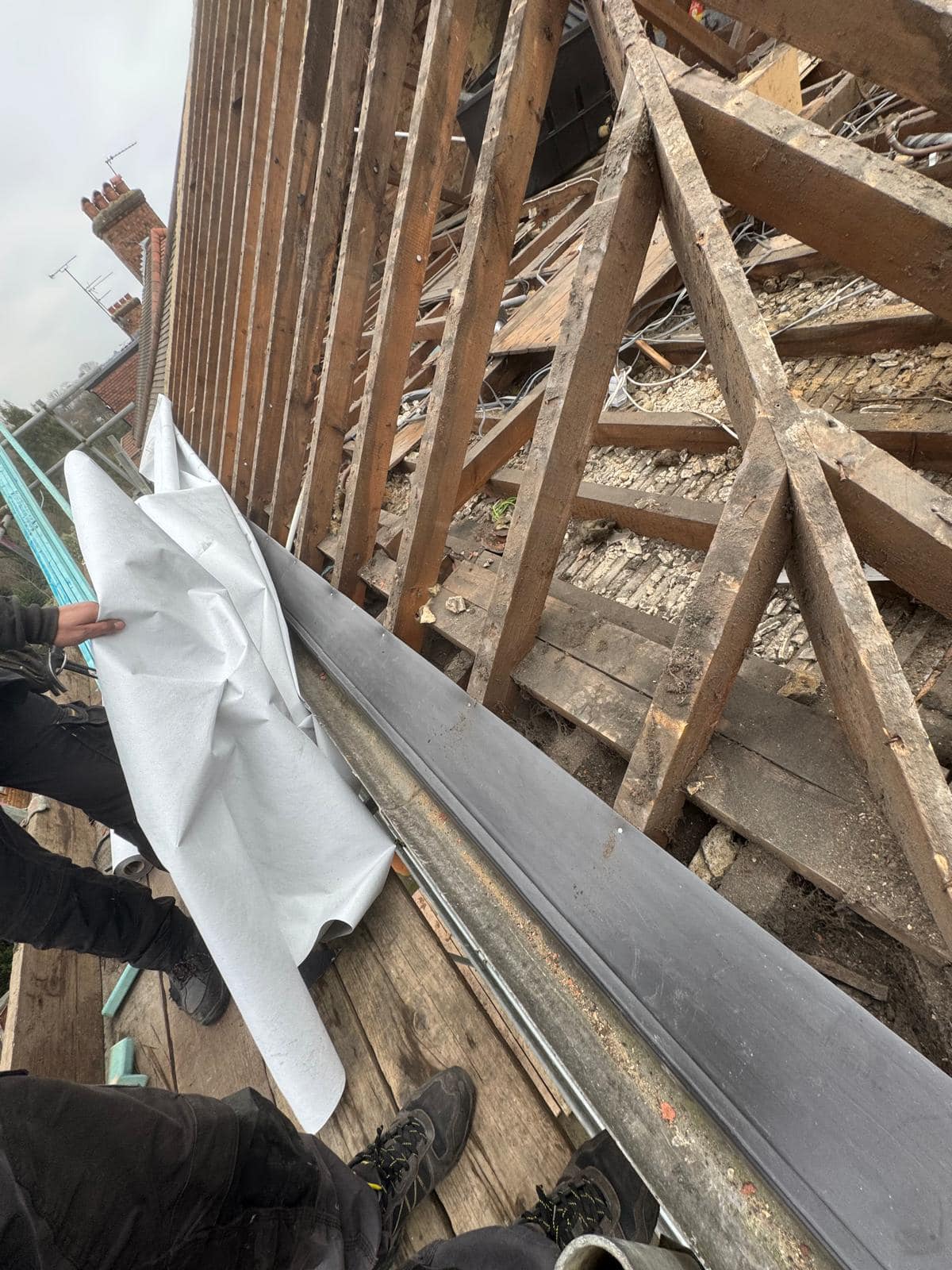 Professional roofers working on a property in London - KS Roof Master