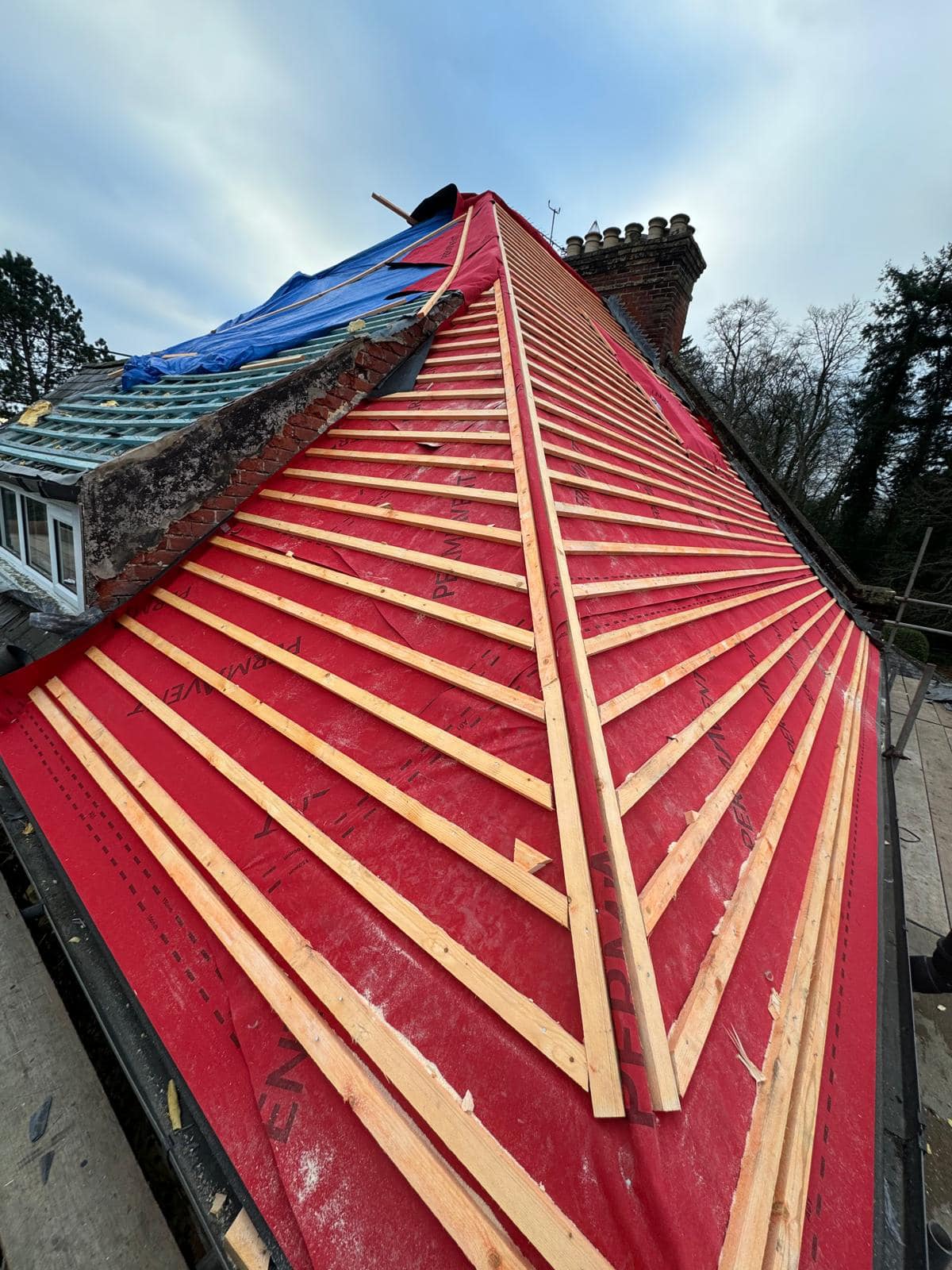 Professional roofers working on a property in London - KS Roof Master