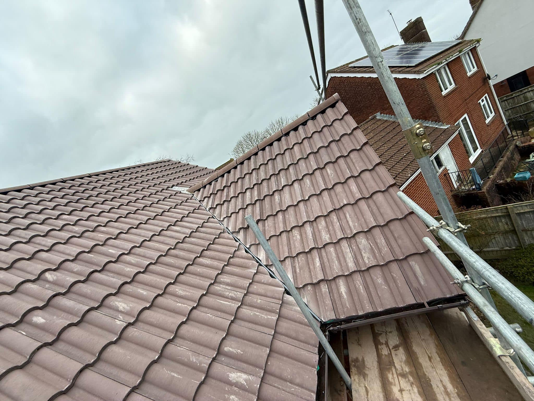 Professional roofers working on a property in London - KS Roof Master