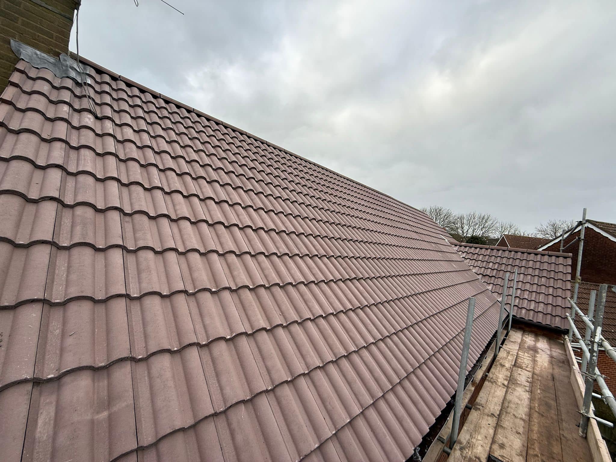 Professional roofers working on a property in London - KS Roof Master