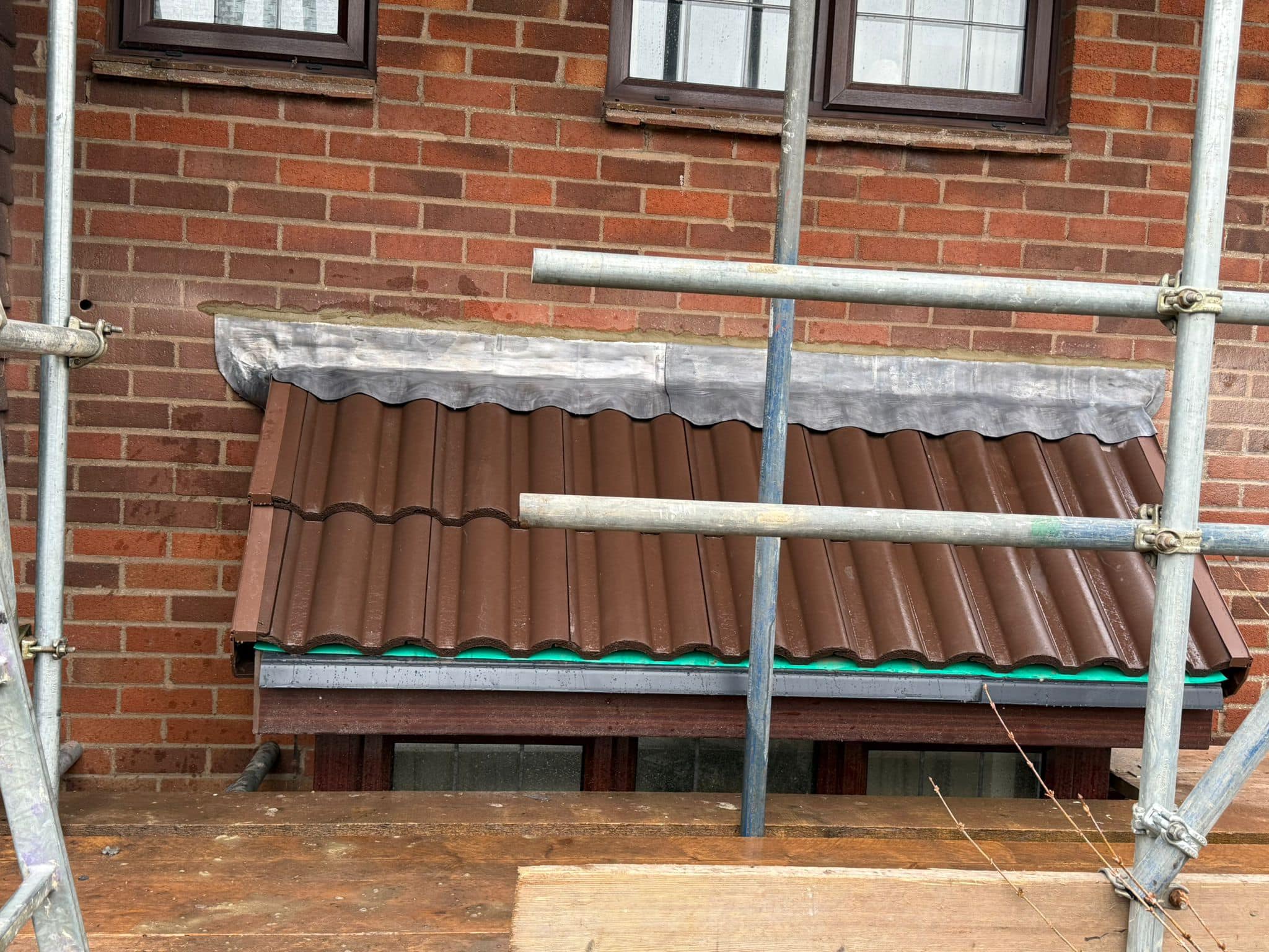 Professional roofers working on a property in London - KS Roof Master