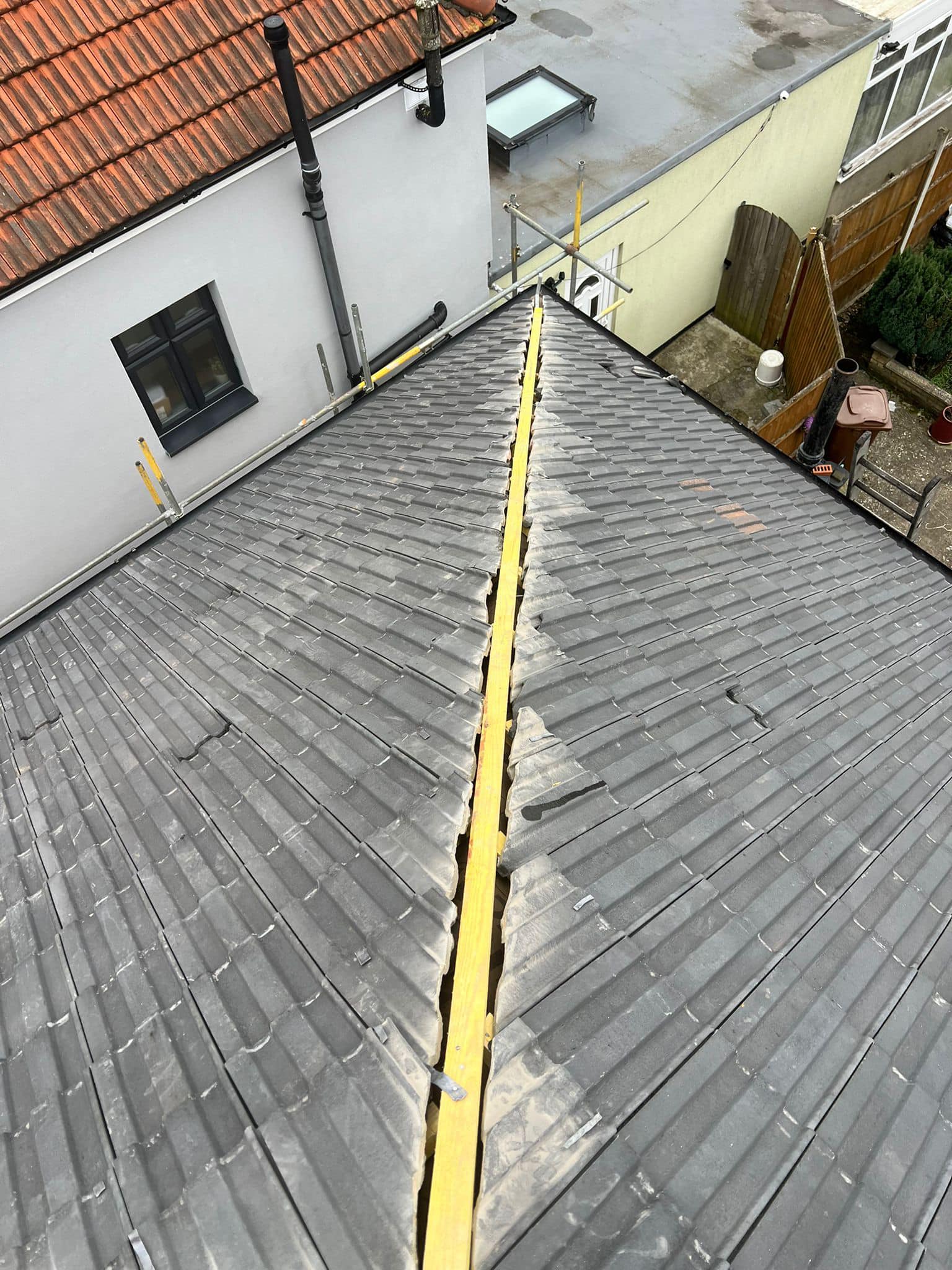 Professional roofers working on a property in London - KS Roof Master