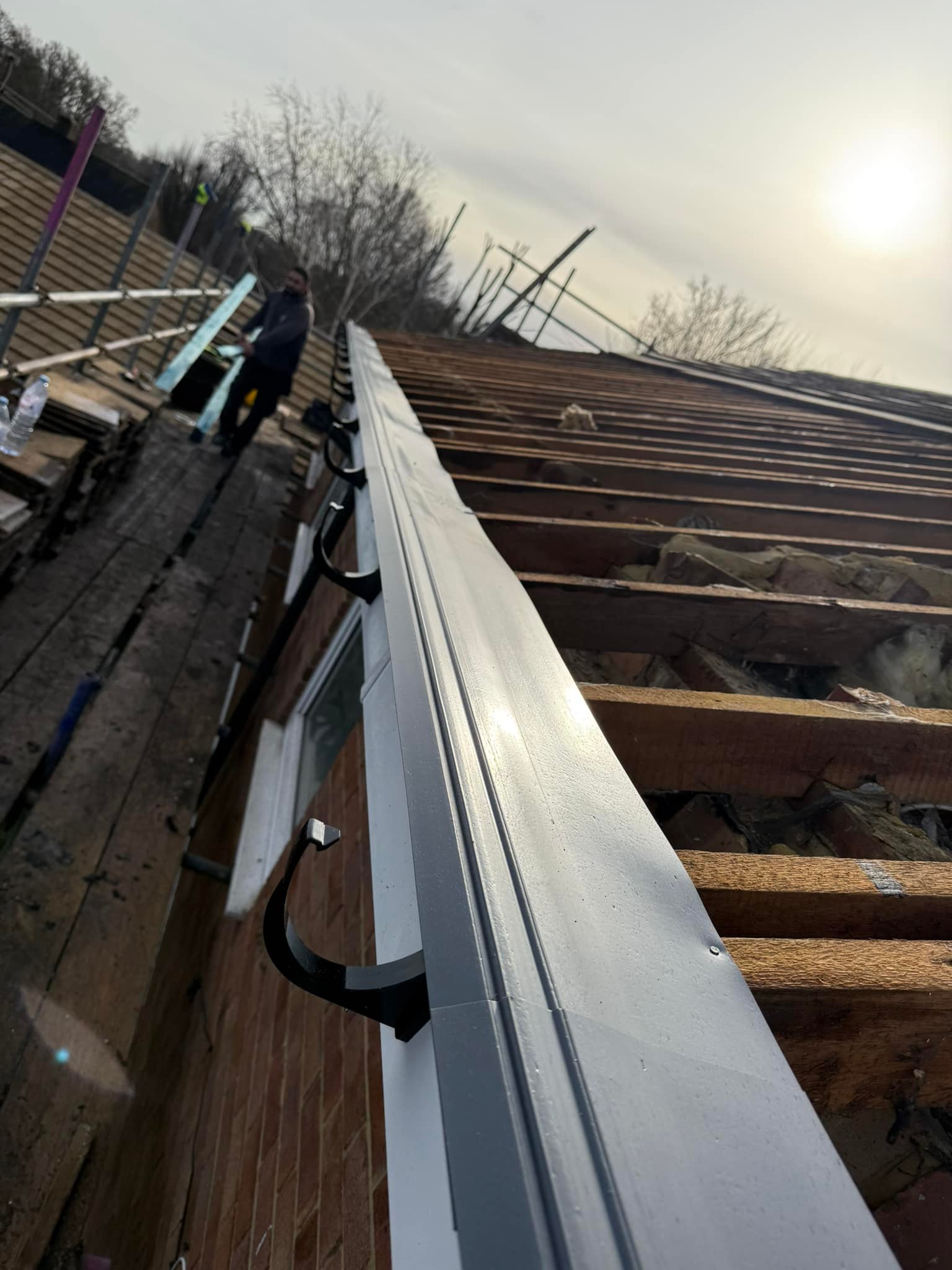 Professional roofers working on a property in London - KS Roof Master