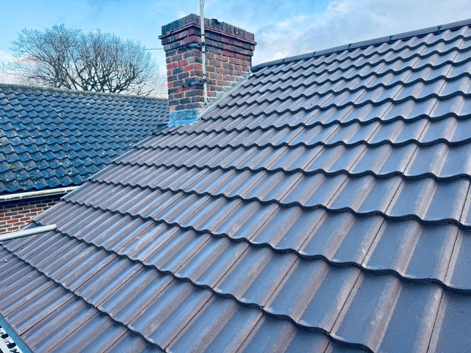 Professional roofers working on a property in London - KS Roof Master