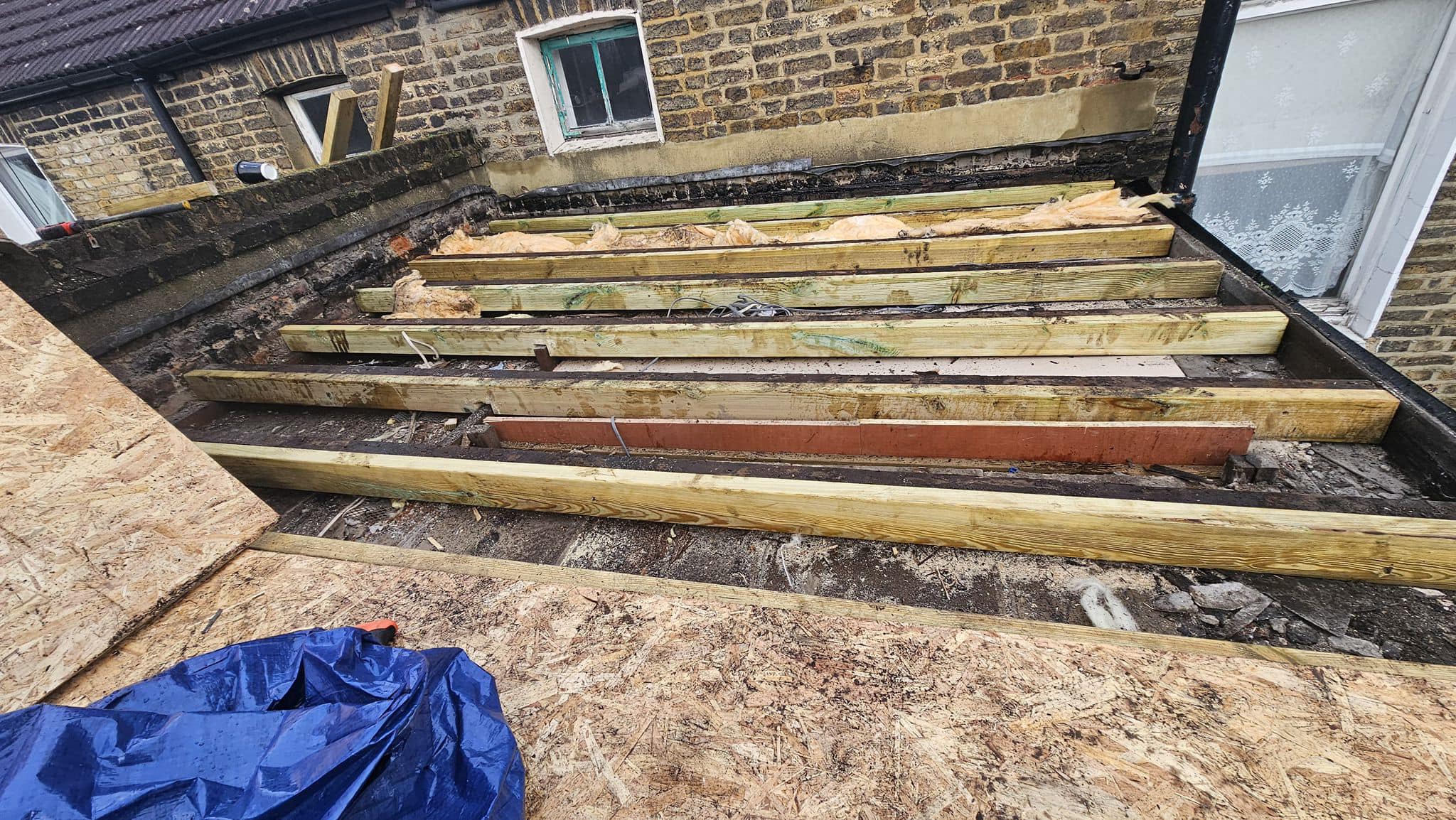Professional roofers working on a property in London - KS Roof Master