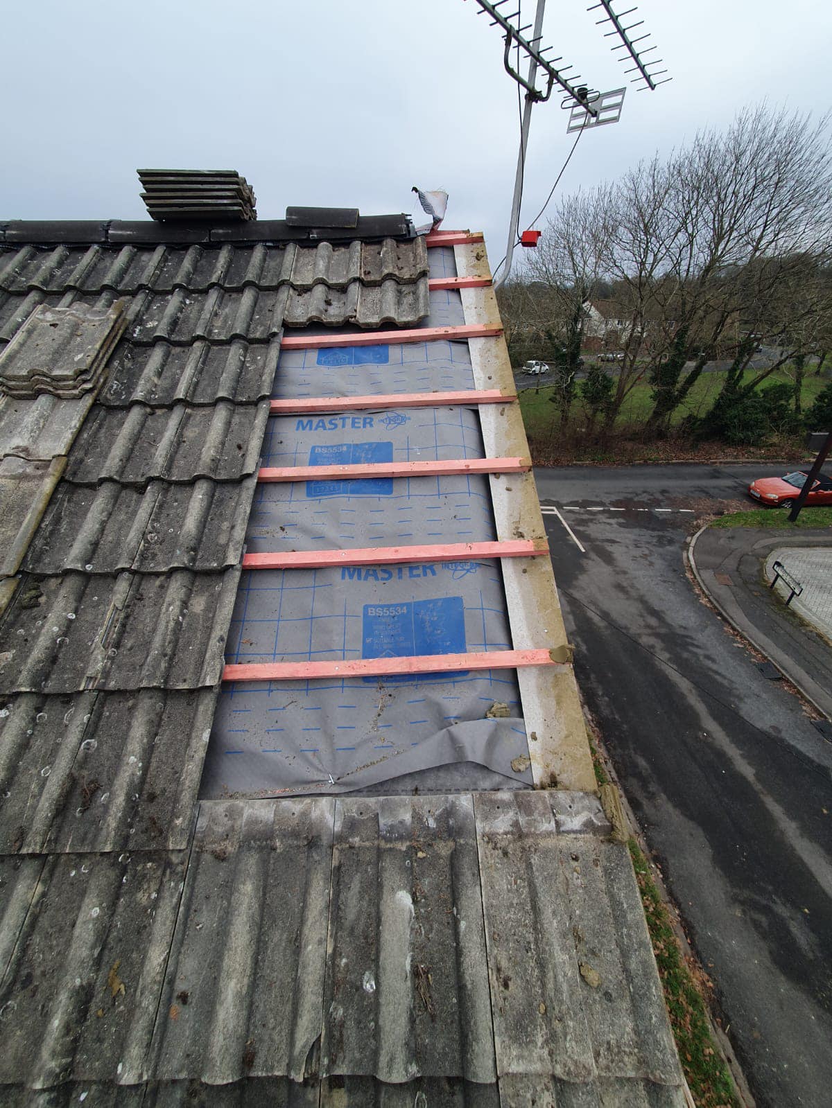 Professional roofers working on a property in London - KS Roof Master