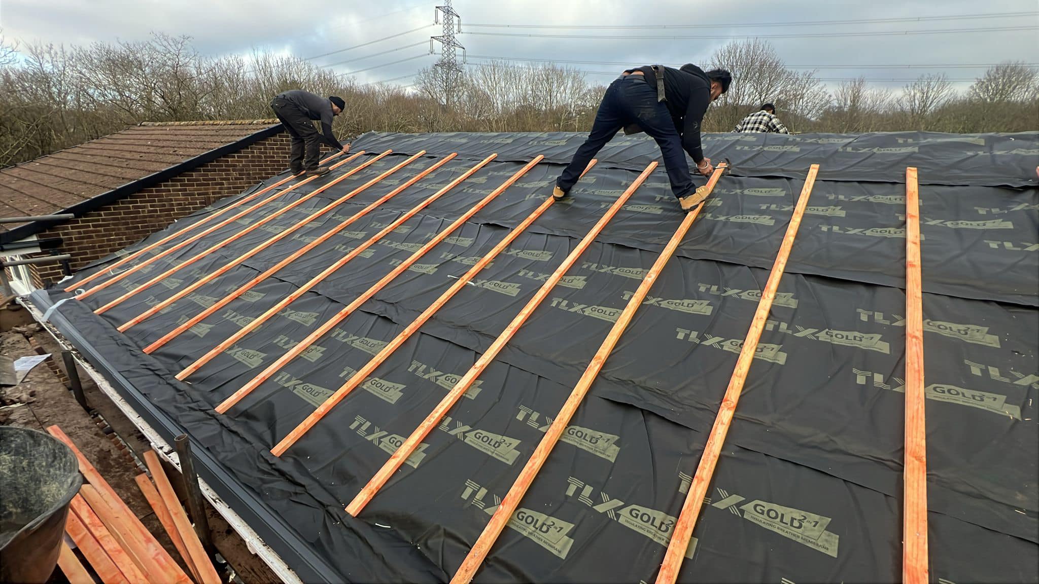 Professional roofers working on a property in London - KS Roof Master
