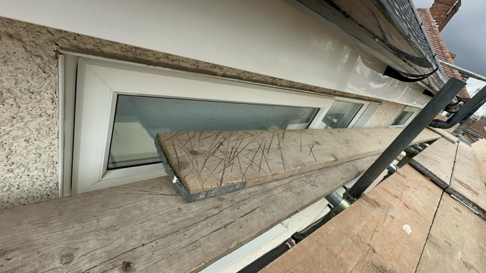 Professional roofers working on a property in London - KS Roof Master