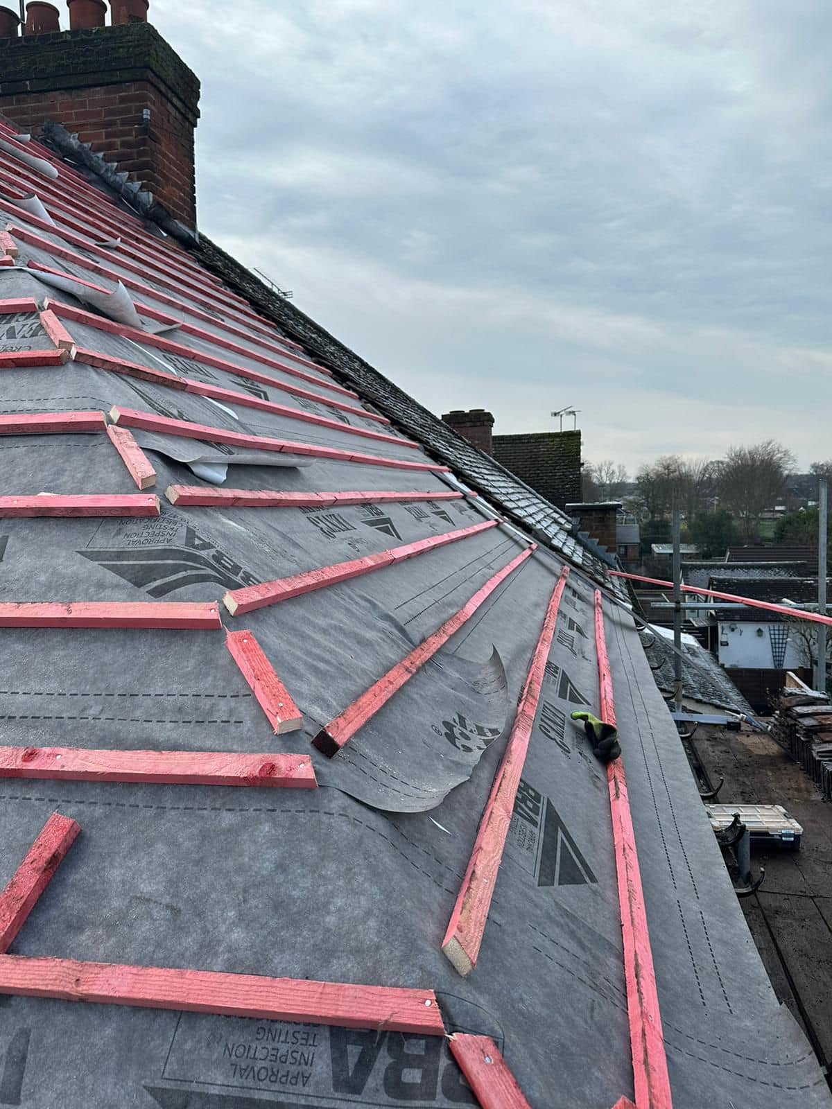 Professional roofers working on a property in London - KS Roof Master