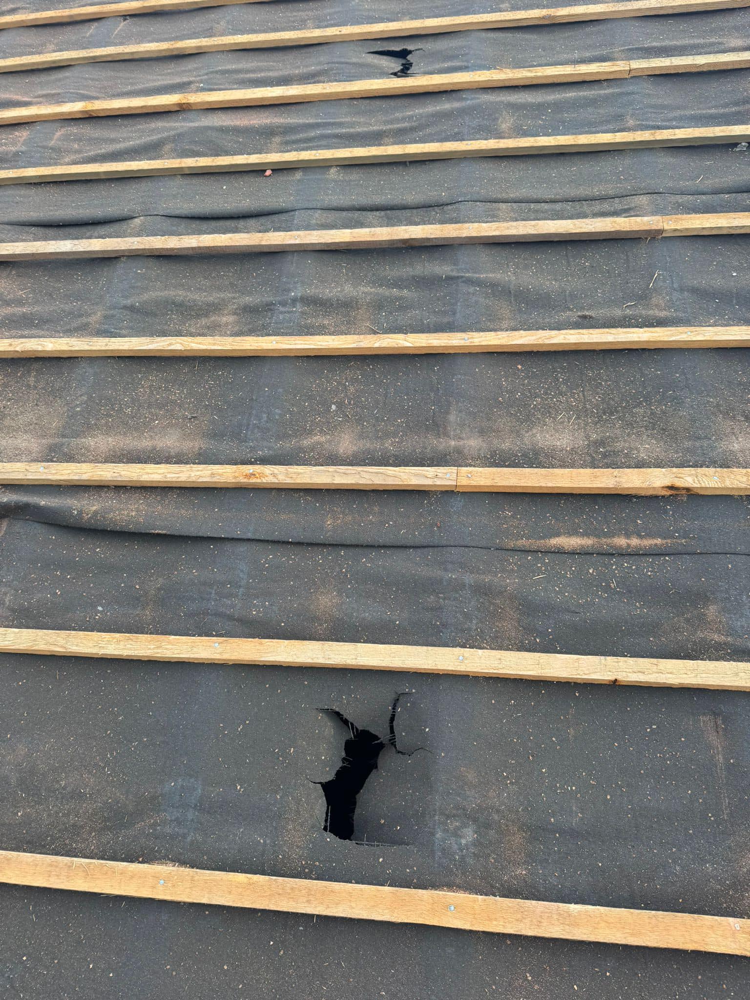 Professional roofers working on a property in London - KS Roof Master