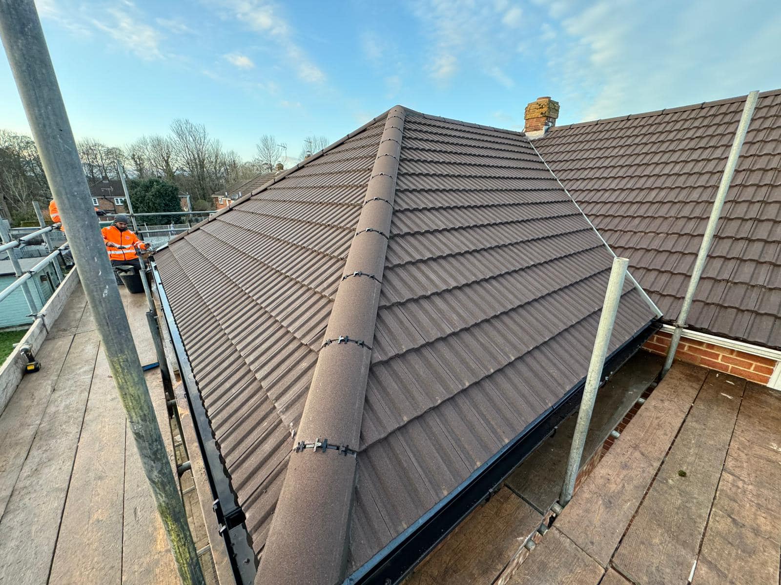 Professional roofers working on a property in London - KS Roof Master