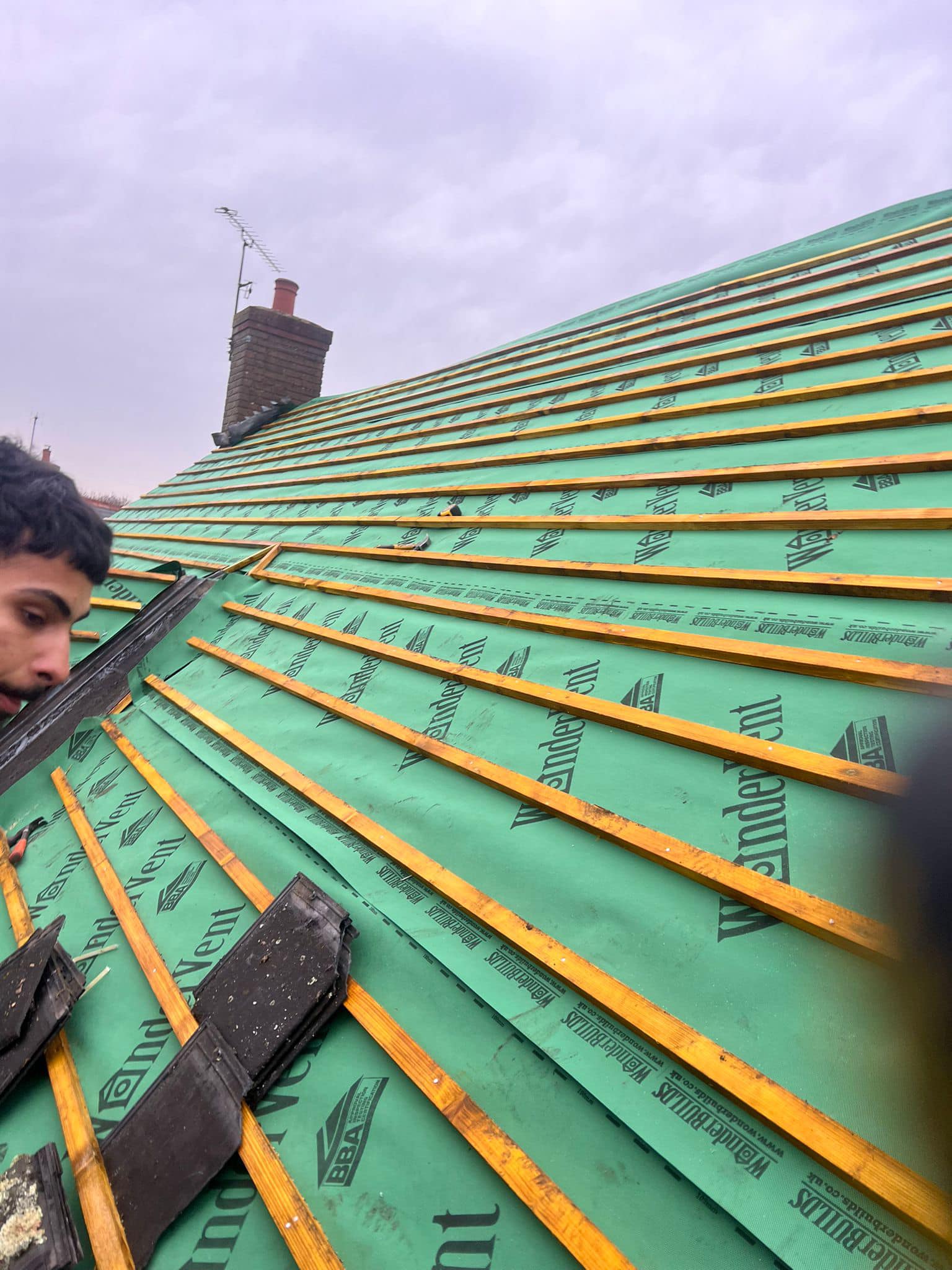 Professional roofers working on a property in London - KS Roof Master
