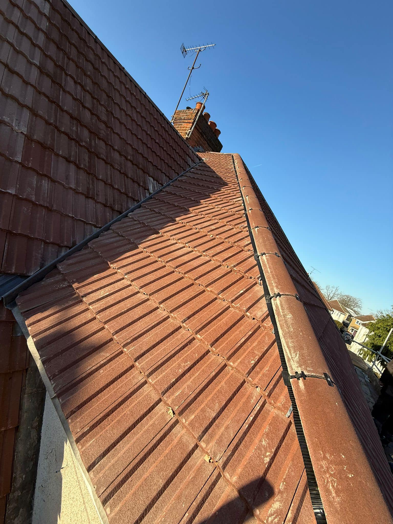 Professional roofers working on a property in London - KS Roof Master