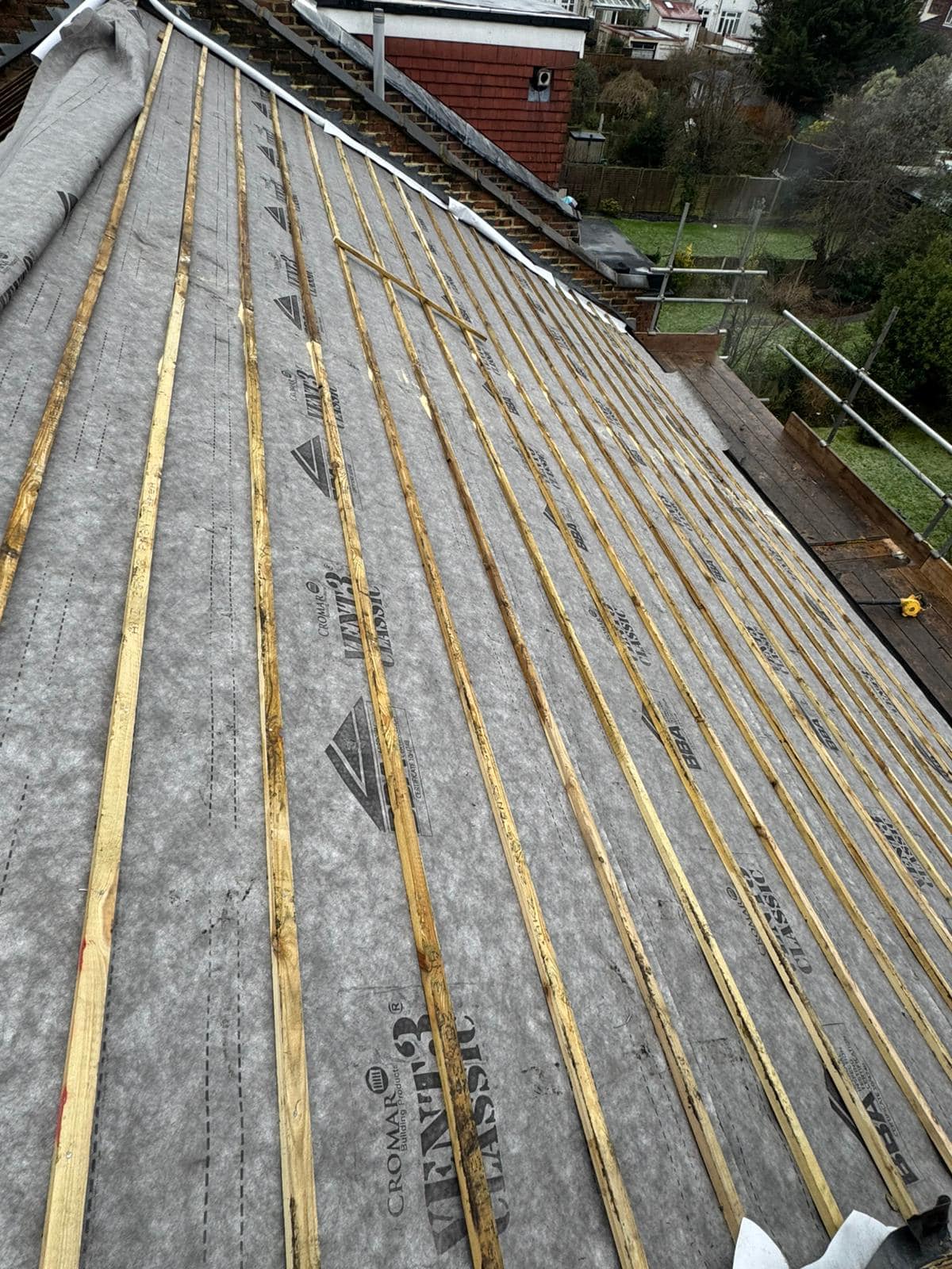Professional roofers working on a property in London - KS Roof Master