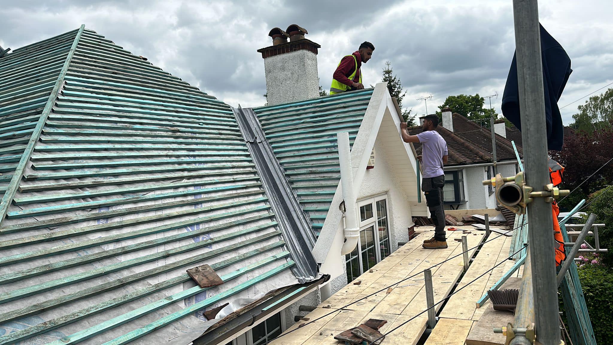 Professional roofers working on a property in London - KS Roof Master