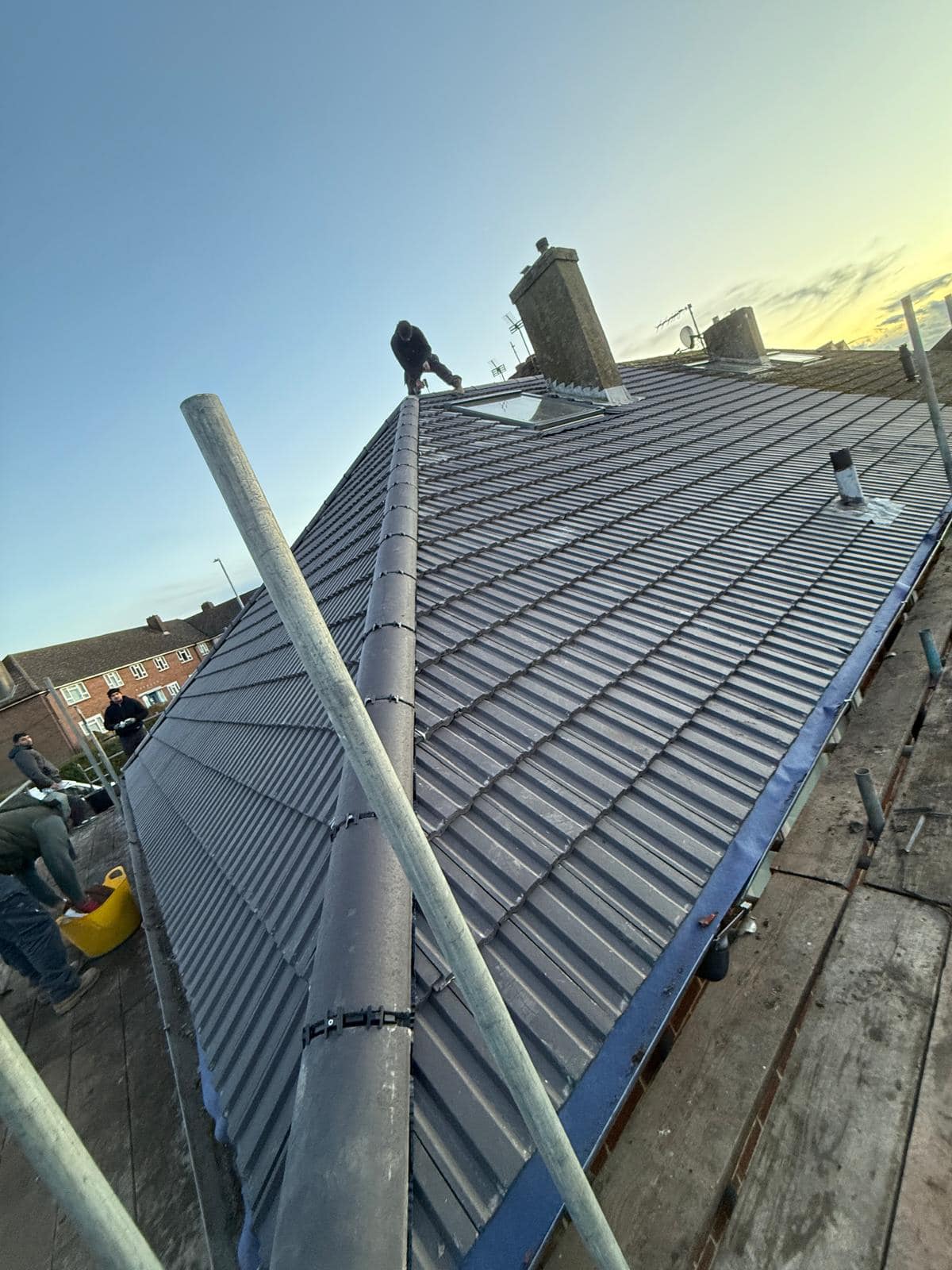 Professional roofers working on a property in London - KS Roof Master