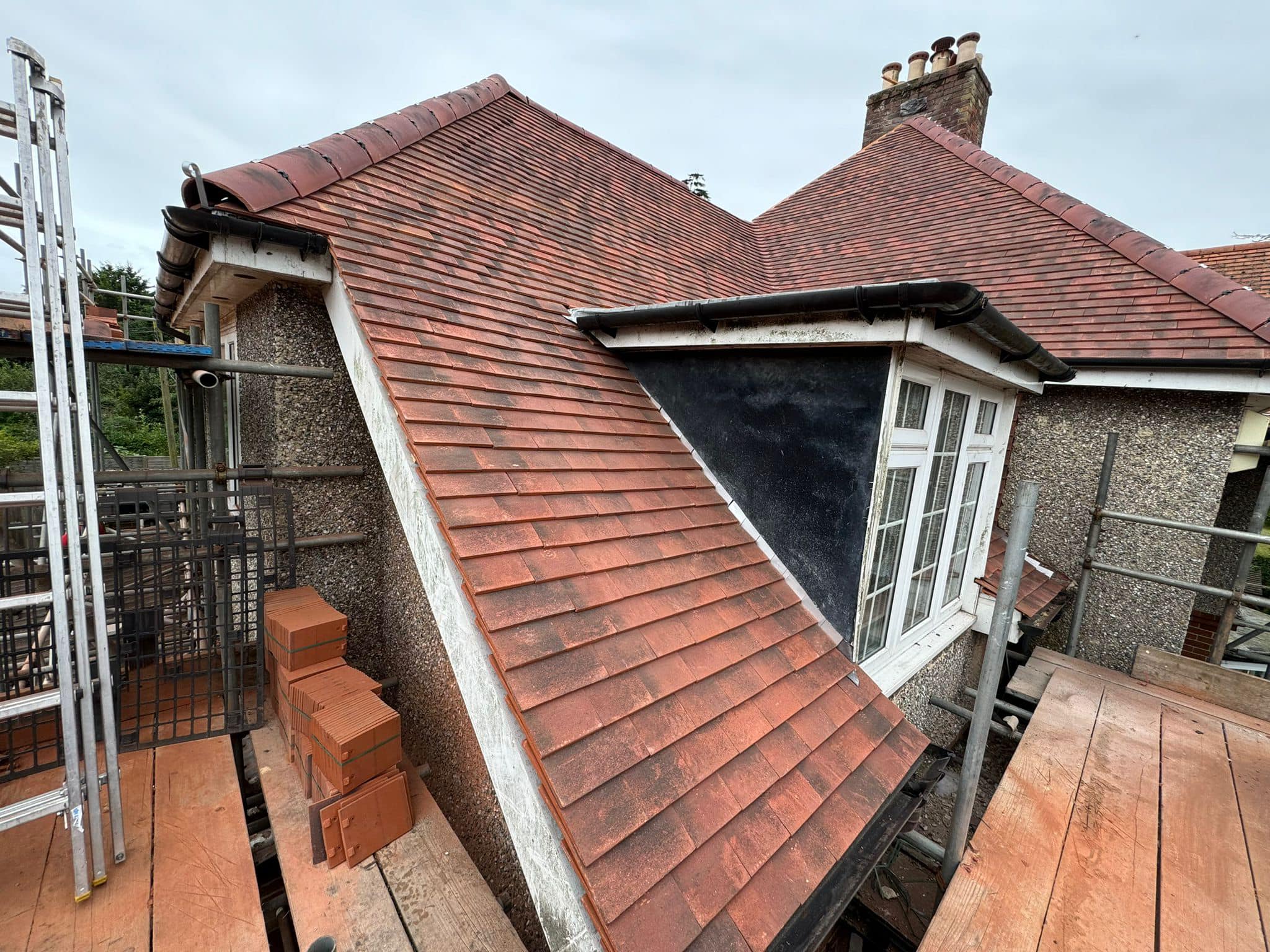 Professional roofers working on a property in London - KS Roof Master