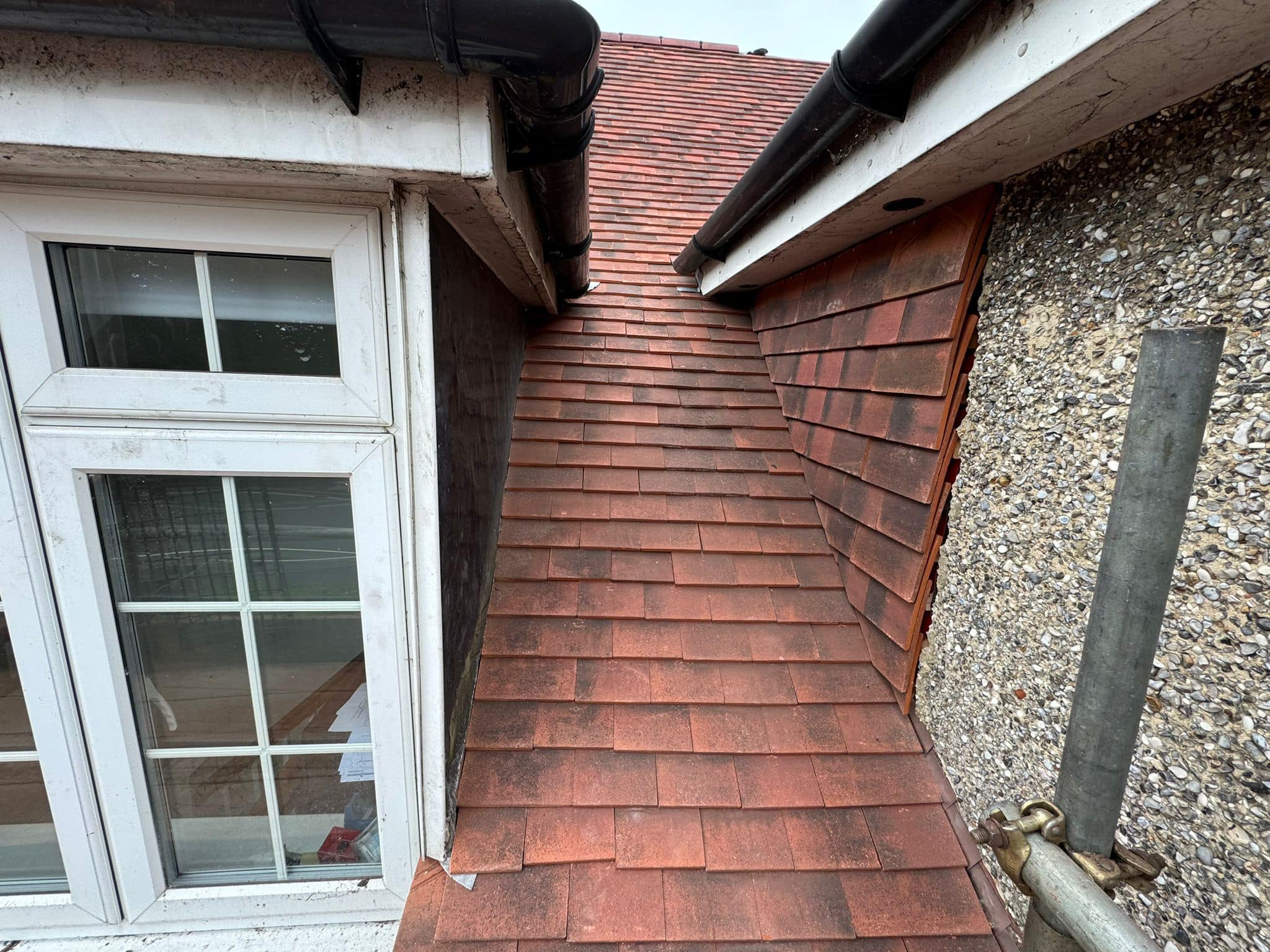 Professional roofers working on a property in London - KS Roof Master