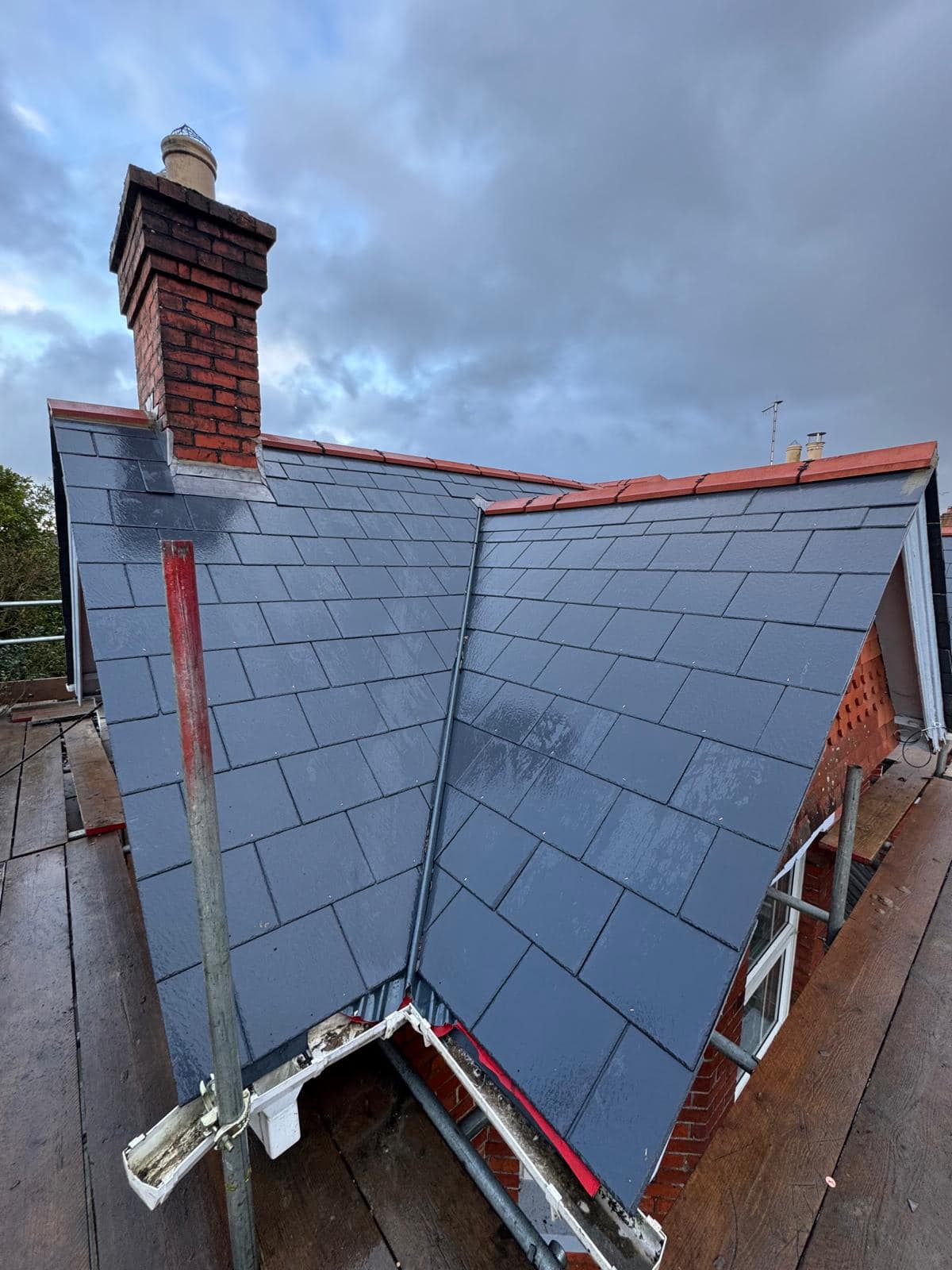 Professional roofers working on a property in London - KS Roof Master