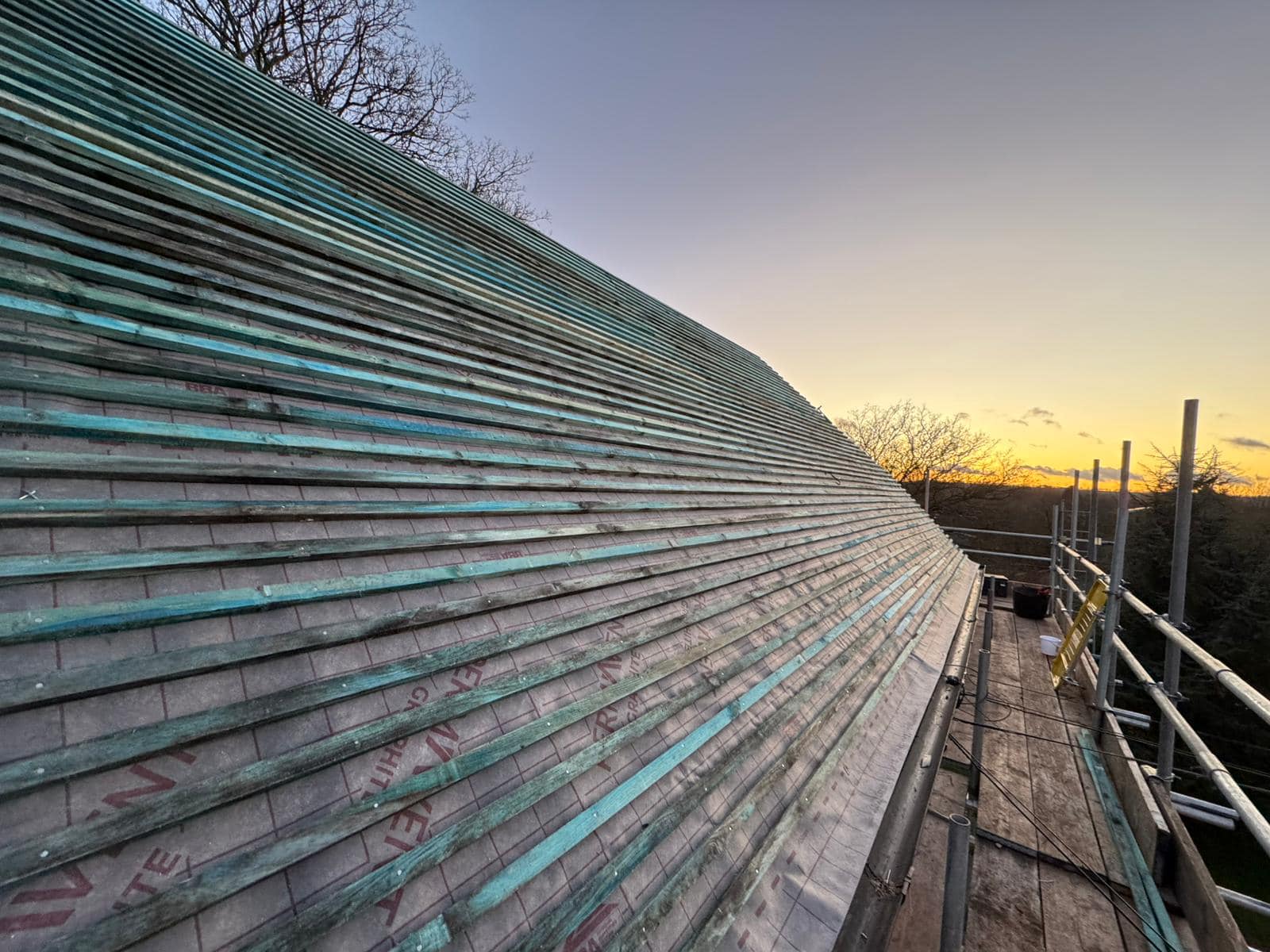 Professional roofers working on a property in London - KS Roof Master