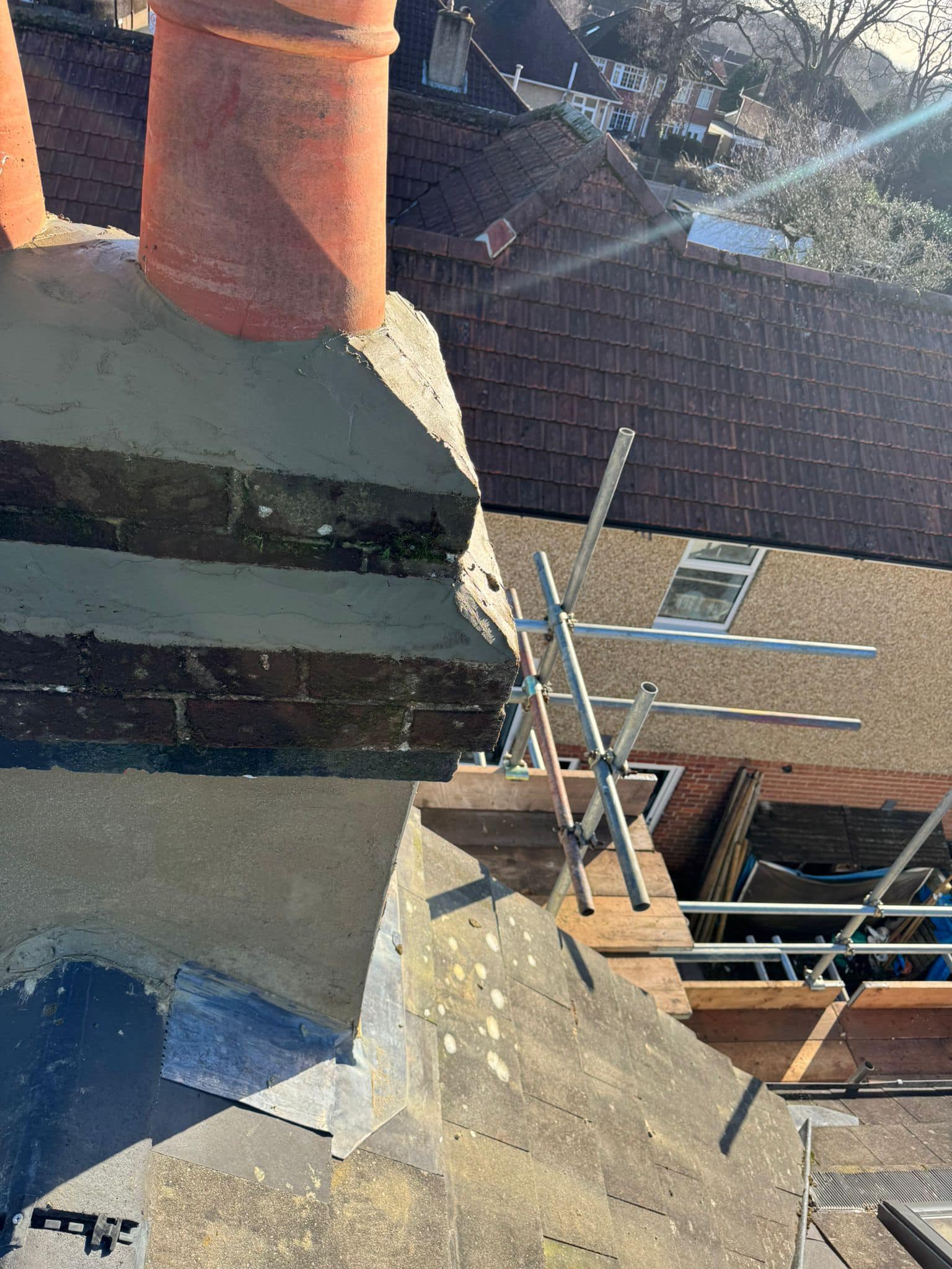Professional roofers working on a property in London - KS Roof Master