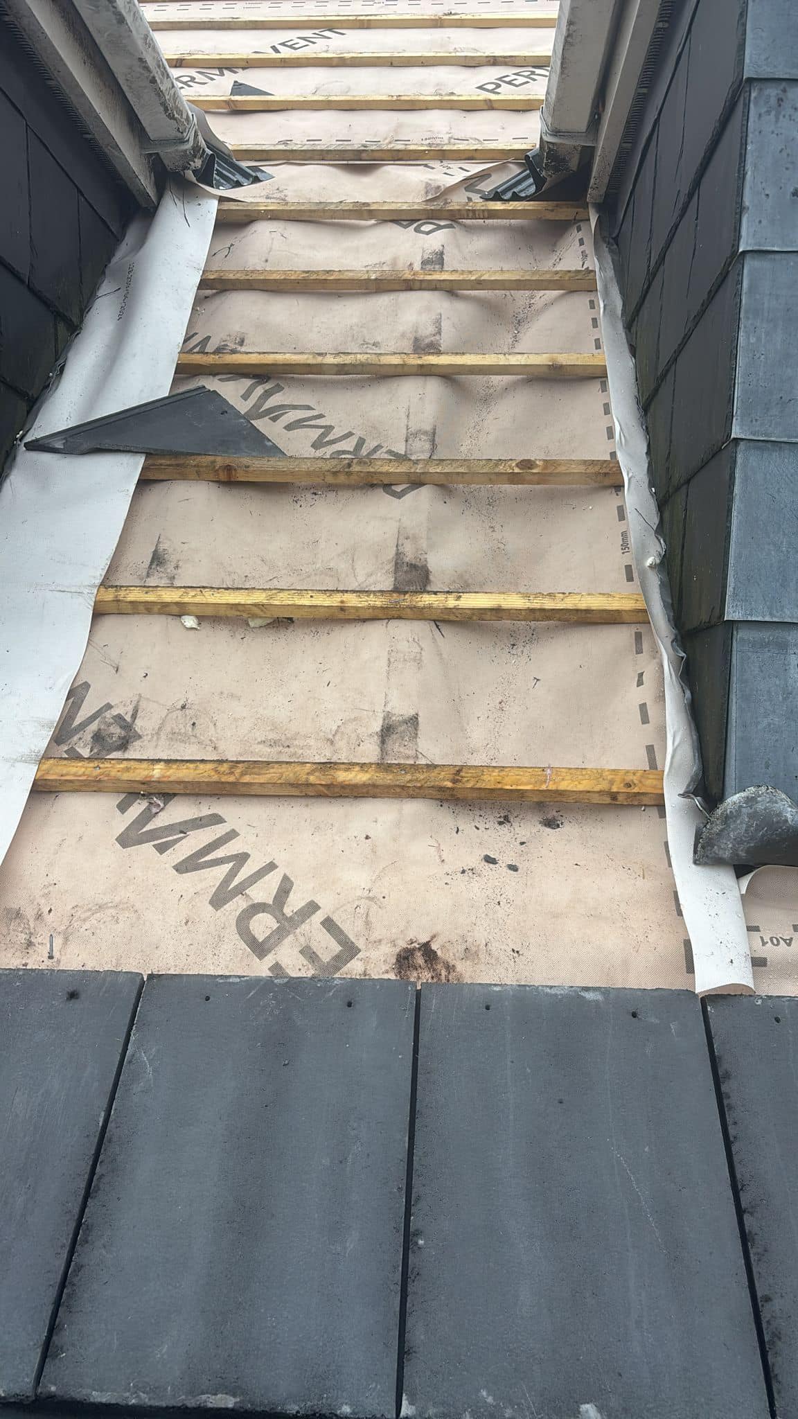 Professional roofers working on a property in London - KS Roof Master