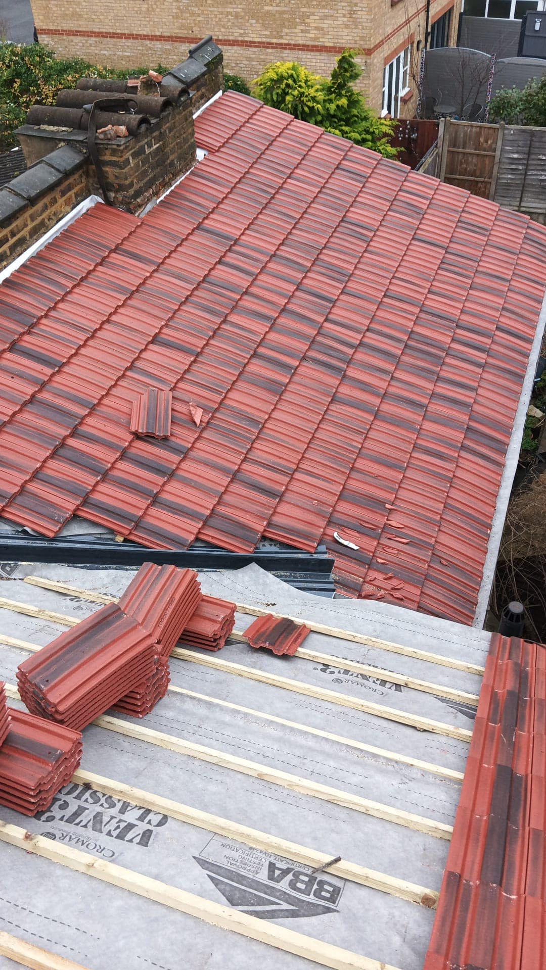 Professional roofers working on a property in London - KS Roof Master