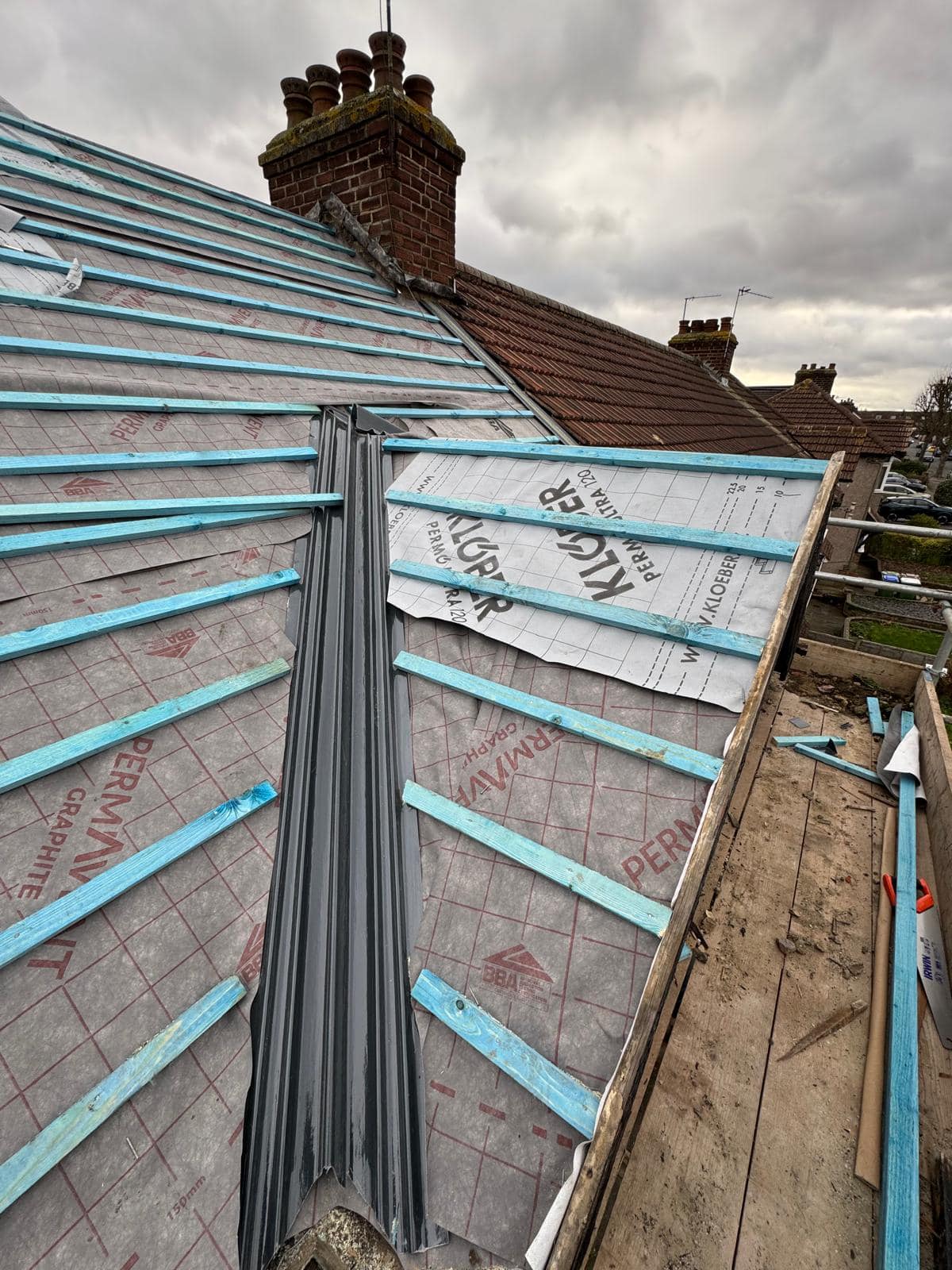 Professional roofers working on a property in London - KS Roof Master
